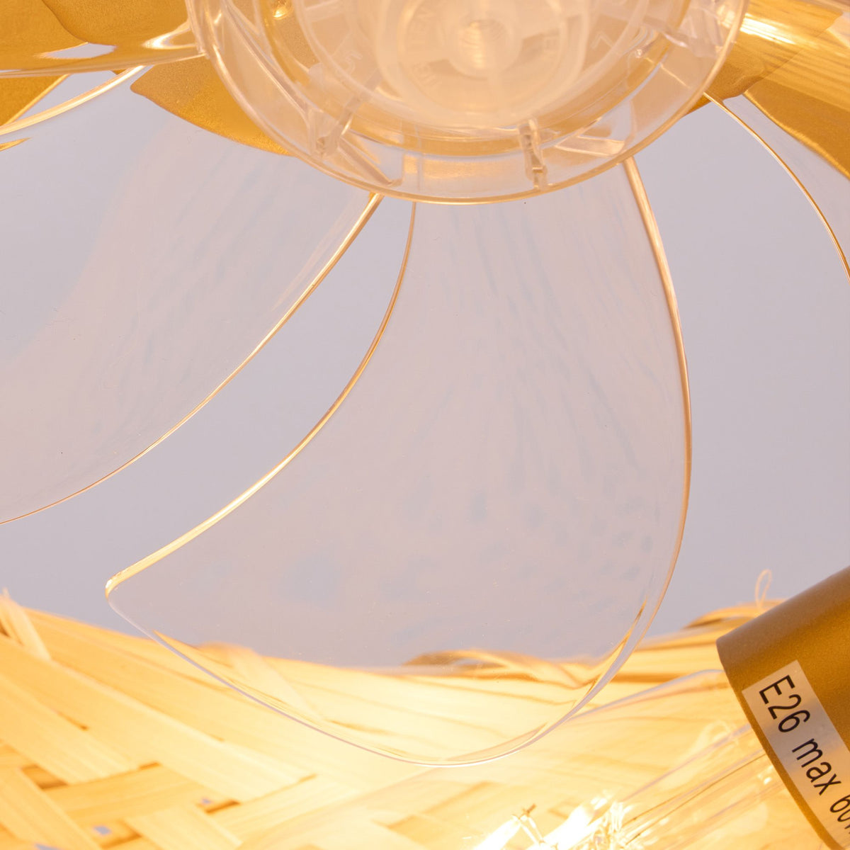 Close-up of fandelier light base — E26 socket label, clear acrylic fan blades, warm rattan weave, premium boho craftsmanship | Sofary Lighting