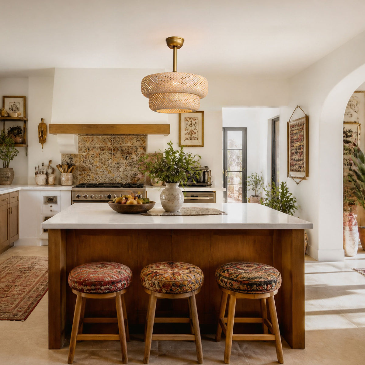 Farmhouse ceiling fan over kitchen island — brass stem rattan fandelier, white countertop, wooden island, patterned stools, cozy kitchen decor | Sofary Lighting