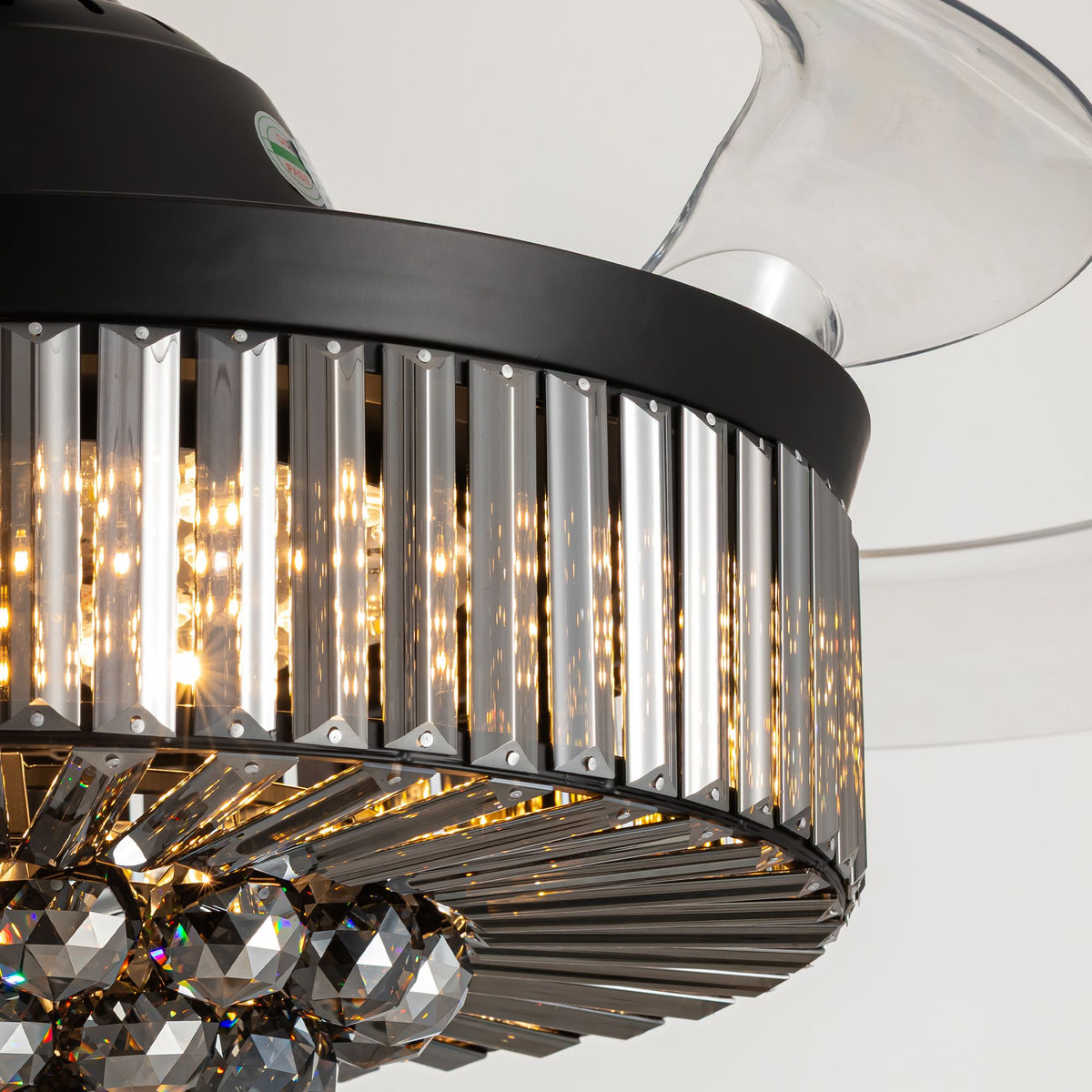 Close-up of crystal fandelier — faceted K9 crystals, warm LED refraction, black metal frame, premium retractable ceiling fan craftsmanship | Sofary Lighting