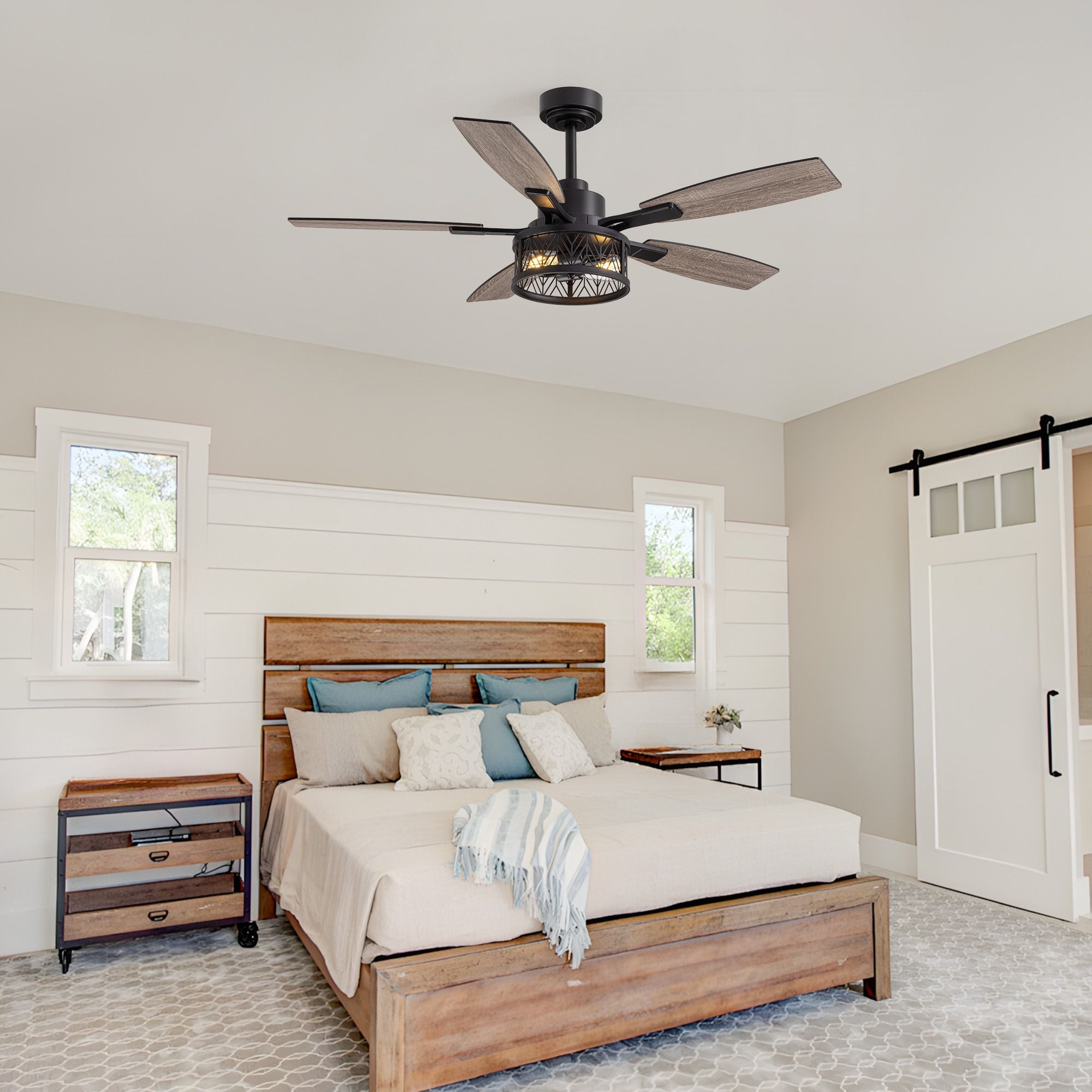 51" farmhouse ceiling fan in bedroom — wood plank headboard, shiplap walls, barn door, blue accent pillows, rustic wooden bed frame | Sofary Lighting