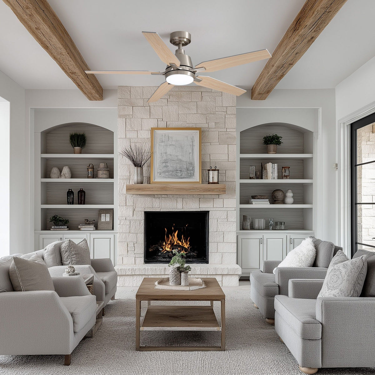 52" ceiling fan in rustic living room — exposed wood beams, stone fireplace, built-in shelves, light gray sofas, warm LED light, spacious farmhouse interior | Sofary Lighting
