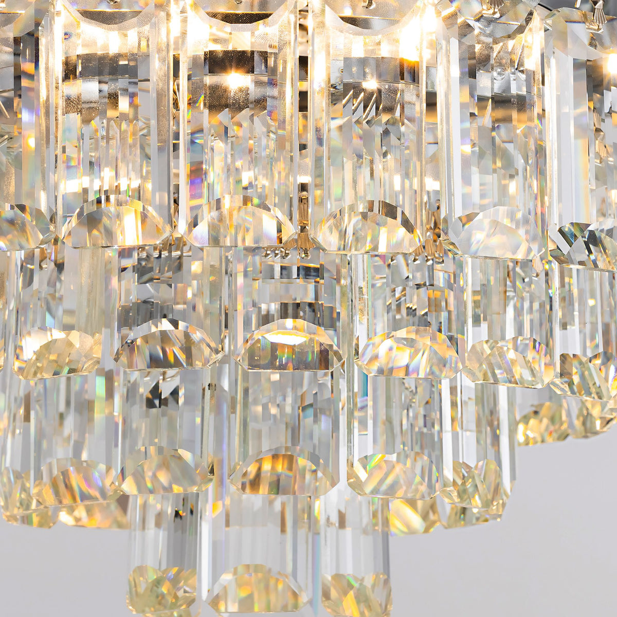 Close-up of crystal chandelier light — multi-faceted clear crystal pendants, warm light refraction, rainbow sparkle, premium crystal ceiling fan detail | Sofary Lighting