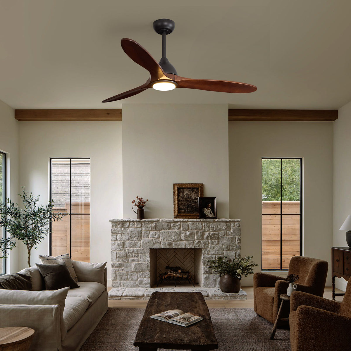 Solid wood blade ceiling fan in living room — stone fireplace, beige sofa, rustic modern decor, bright open space | Sofary Lighting