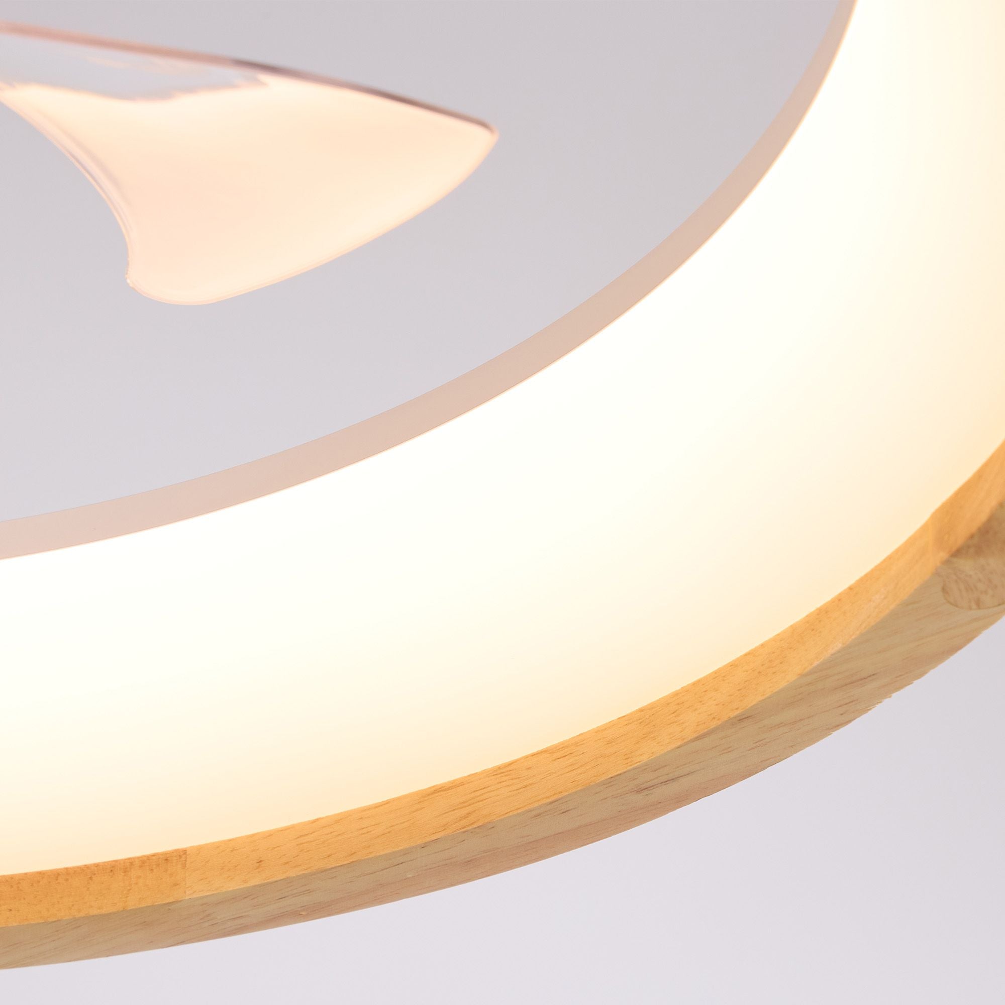 Close-up of Aeria LED Ceiling Fan — warm circular light ring, translucent fan blades, soft glow, wood edge and modern minimal detail | Sofary Lighting