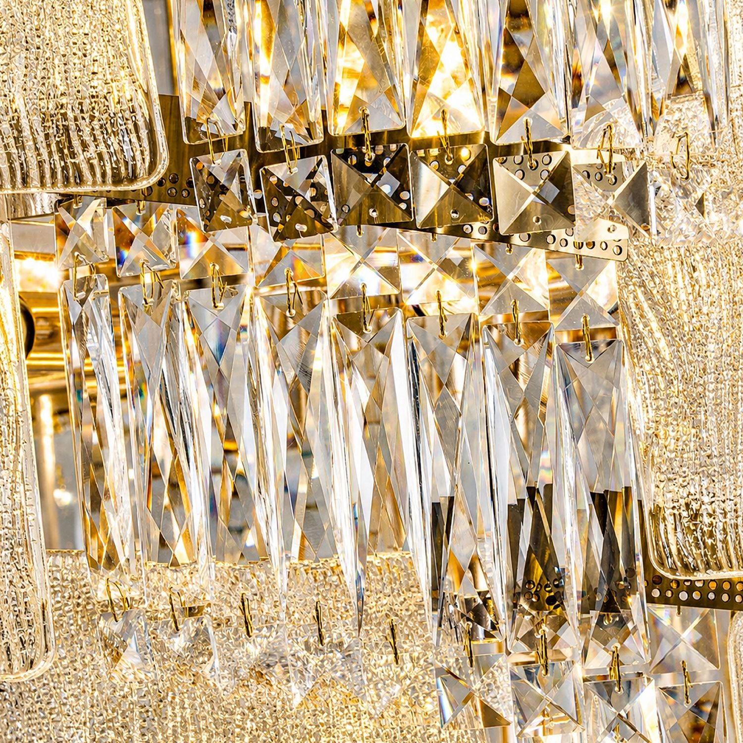 Aerioz chandelier close-up — cascading K9 crystal prisms and strands, faceted teardrop beads, gold hardware, sparkling light refraction, hand-hung waterfall detailing | Sofary Lighting