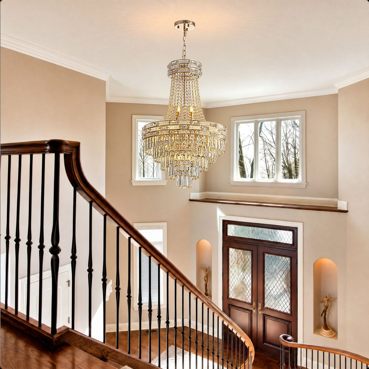 Aeros Empire Gold Chandelier over curved staircase — black railings, second-floor landing, small windows, tiered crystal beads, dramatic foyer lighting | Sofary Lighting