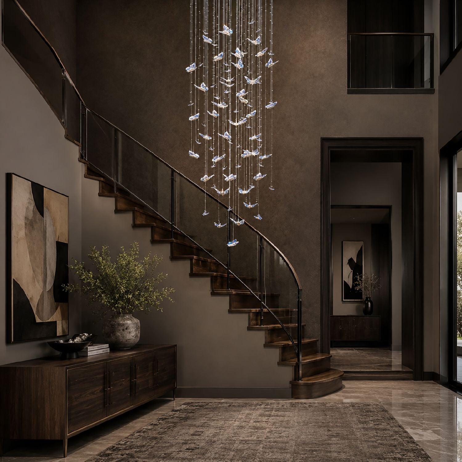 Aerosus Crystal Waterfall Chandelier suspended over a spiral staircase with black metal railing, dark wood panels, and ambient lighting — architectural drama elevated | Sofary Lighting