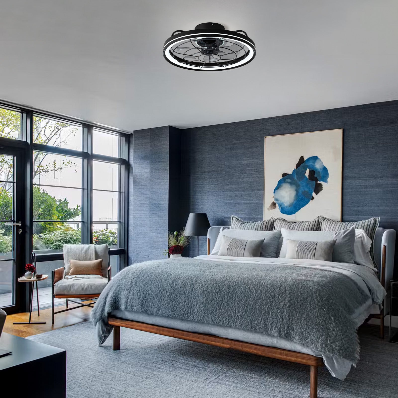 Aerox Caged Ceiling Fan in modern bedroom — gray bedding, blue abstract art, large windows, quiet reversible airflow, smart control for restful sleep | Sofary Lighting