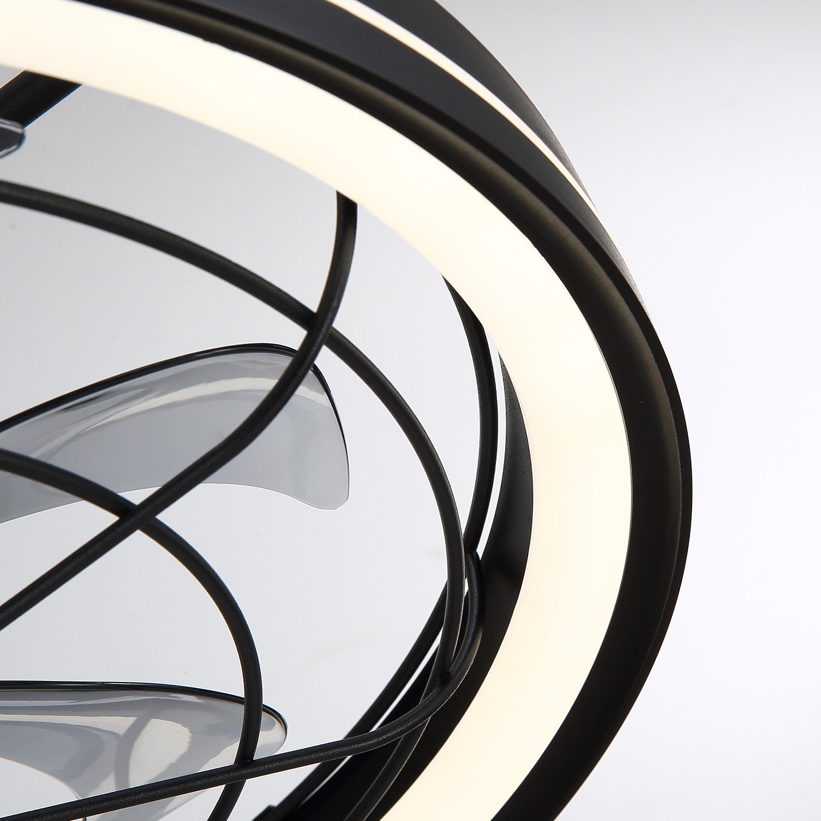 Close-up of Aerox Caged Fan — black metal frame, curved protective cage, integrated LED ring, secure blade mounting, premium build quality | Sofary Lighting