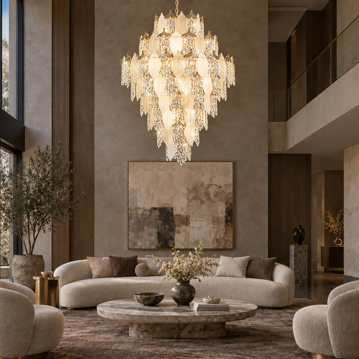 Aevum Gold Chandelier in double-height living room — tall windows, curved sofa, marble coffee table, cascading crystal leaves, warm luxury ambiance | Sofary Lighting