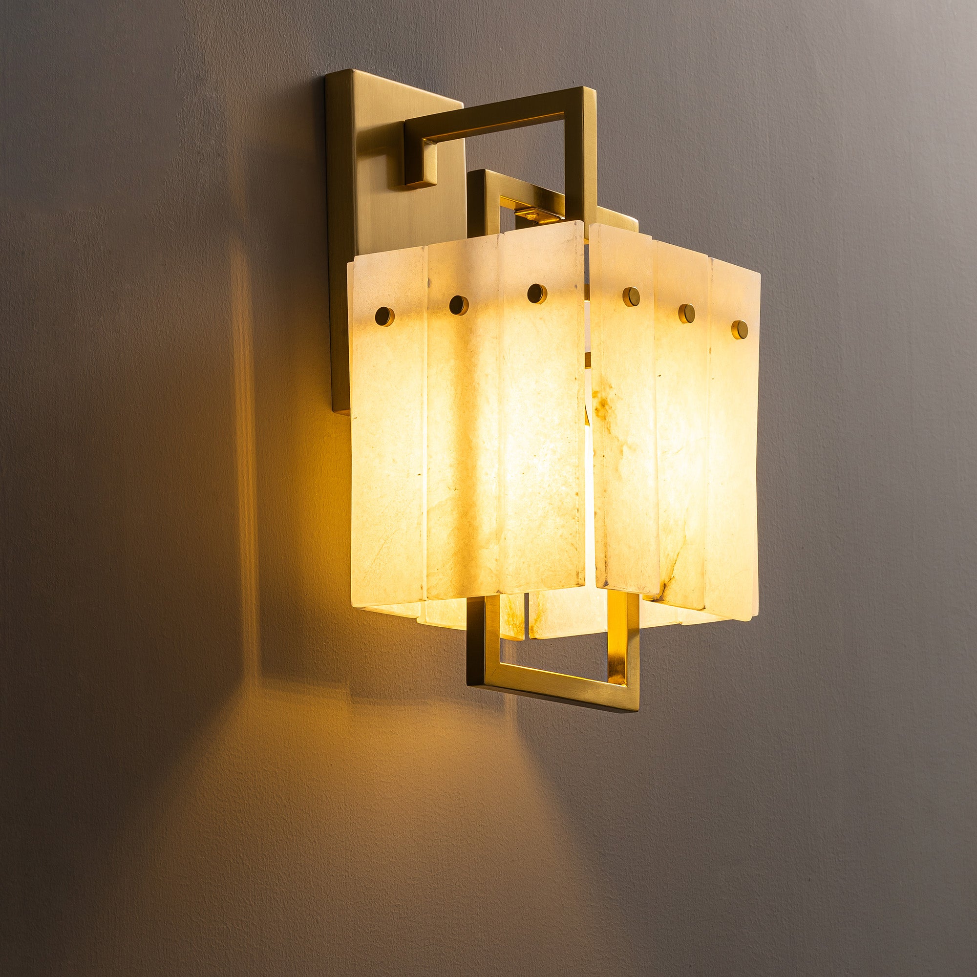 althea-modern-minimalist-brass-alabaster-box-wall-sconce-turn-on-in-the-room-sofary