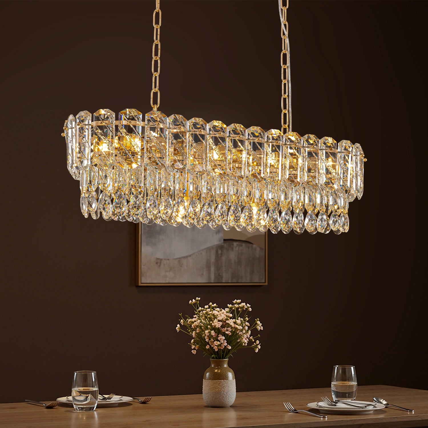 elara-gold-crystal-rectangular-chandelier-over-a-dining-room-sofary-lighting