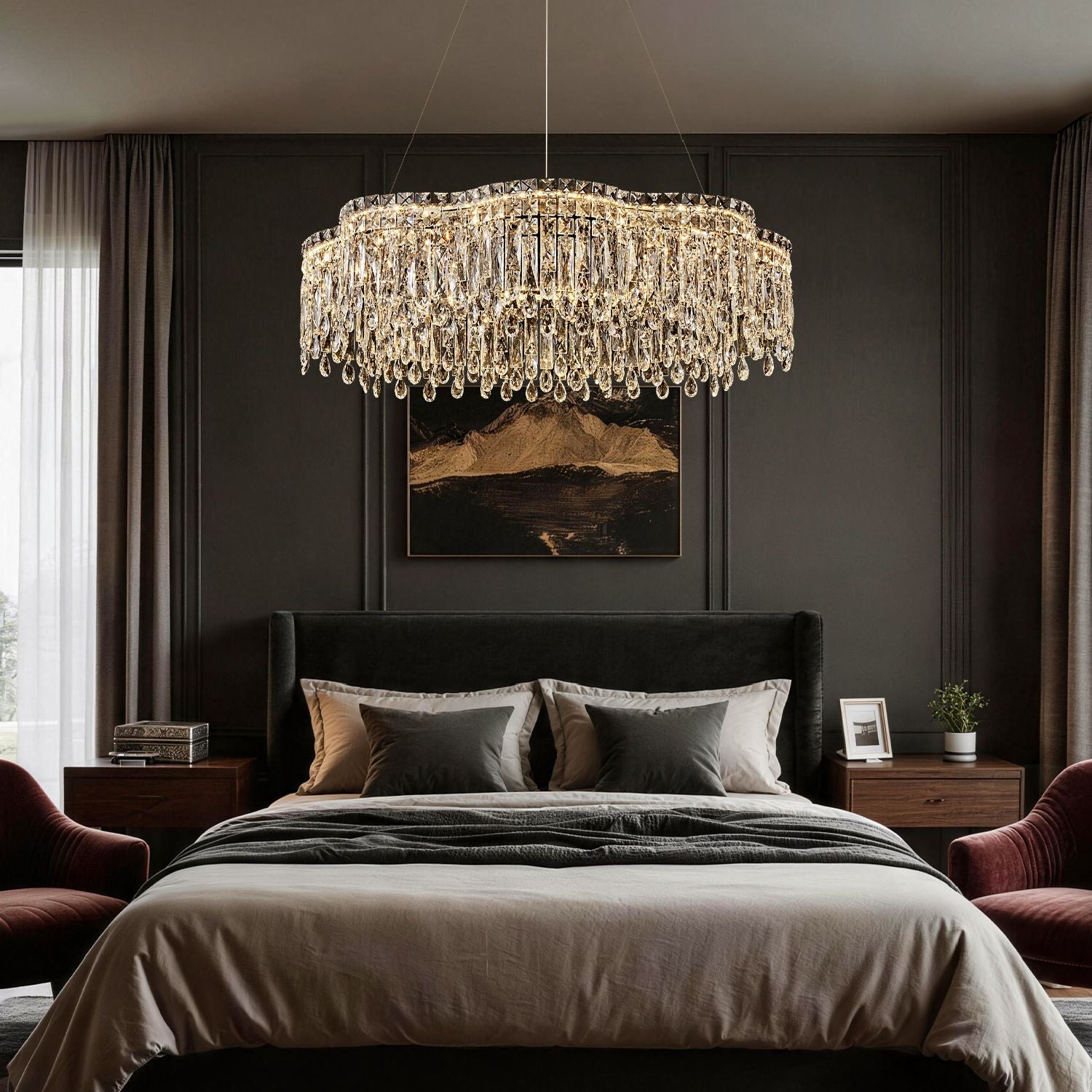 Luna Modern Wave Integrated LED K9 Crystal Ring Chandelier in a bedroom — hanging above a bed with a black headboard, neutral bedding, and dark paneled walls | Sofary Lighting