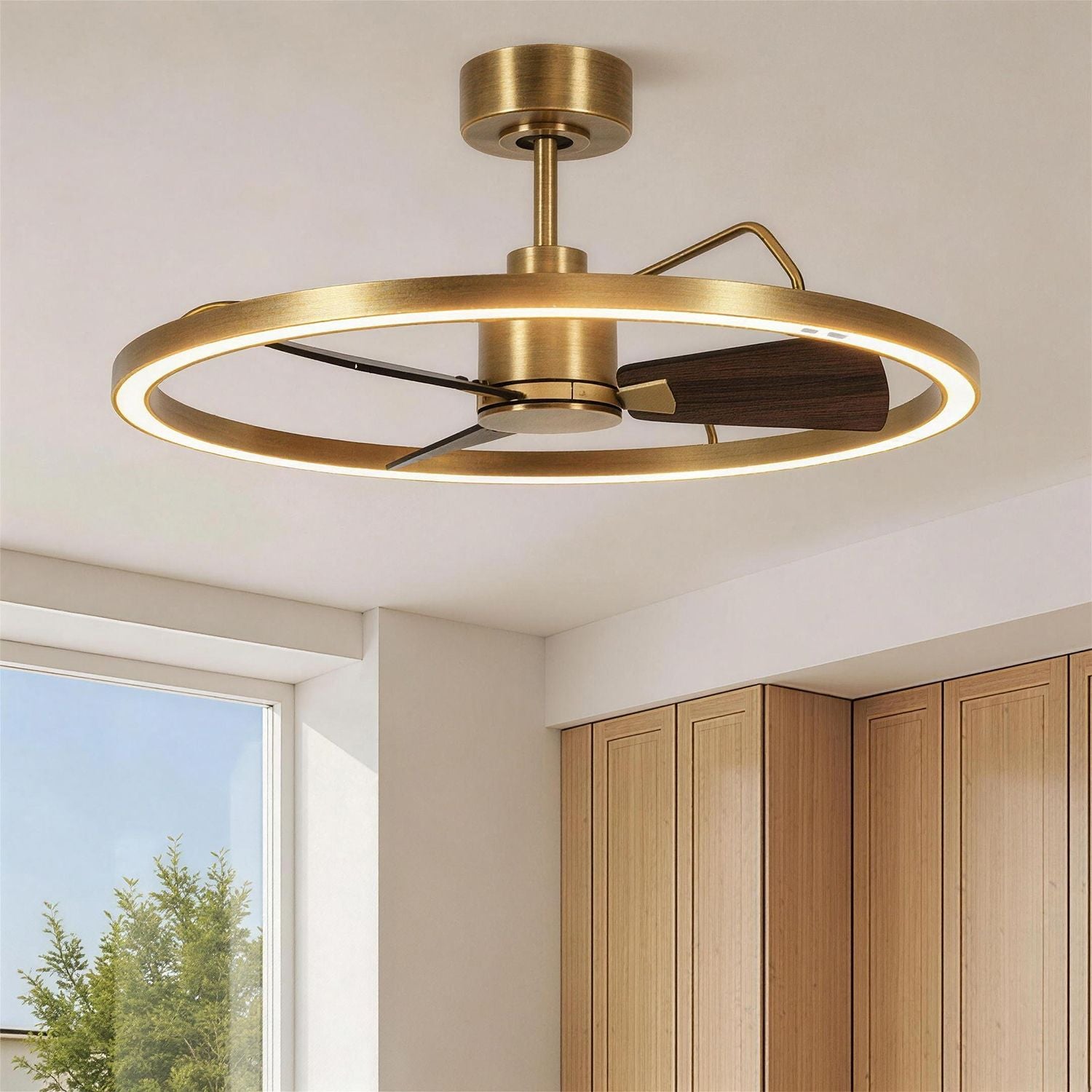 modern brass ring ceiling fan with integrated led light and wooden blades installed on ceiling