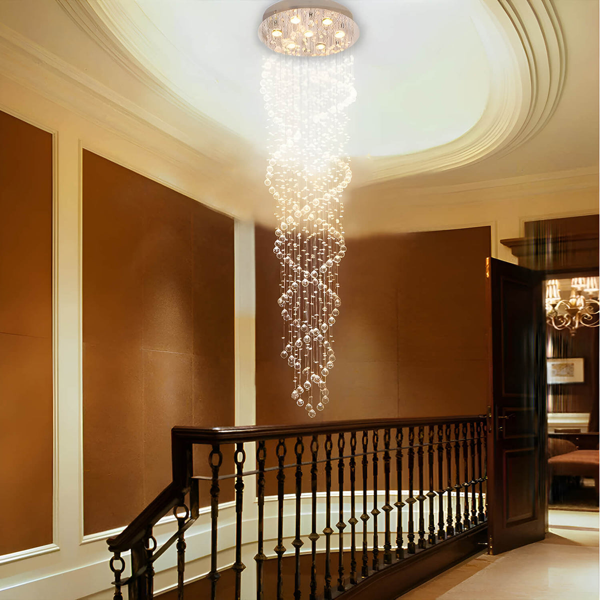 modern chrome k9 crystal spiral chandelier lighting hallway and staircase area with warm glow | Sofary