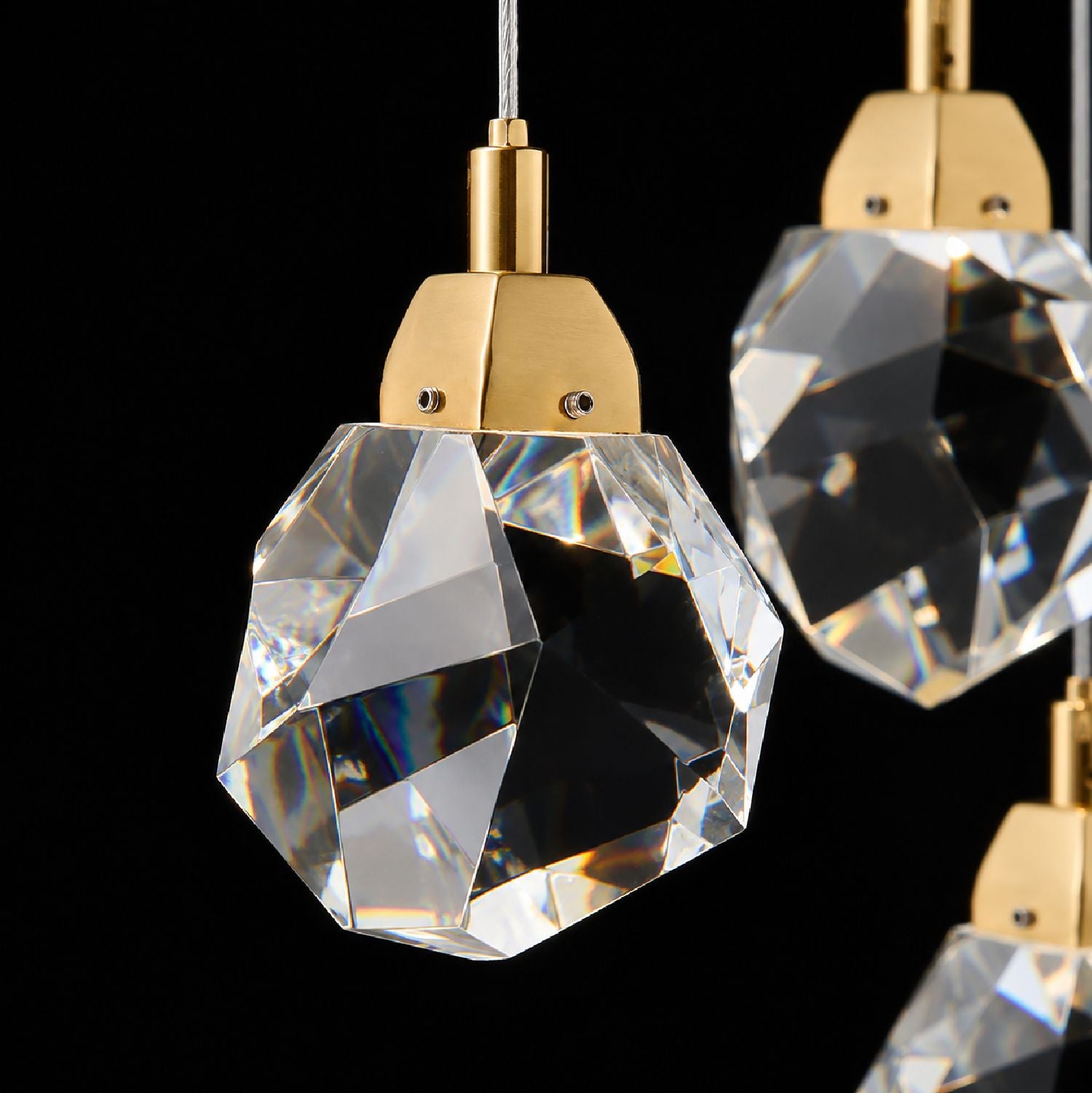 Close-up of Nirvana’s K9 crystal raindrops — precision-cut facets, gold-tone connectors, and light refraction creating prismatic rainbow sparkle against black background | Sofary Lighting