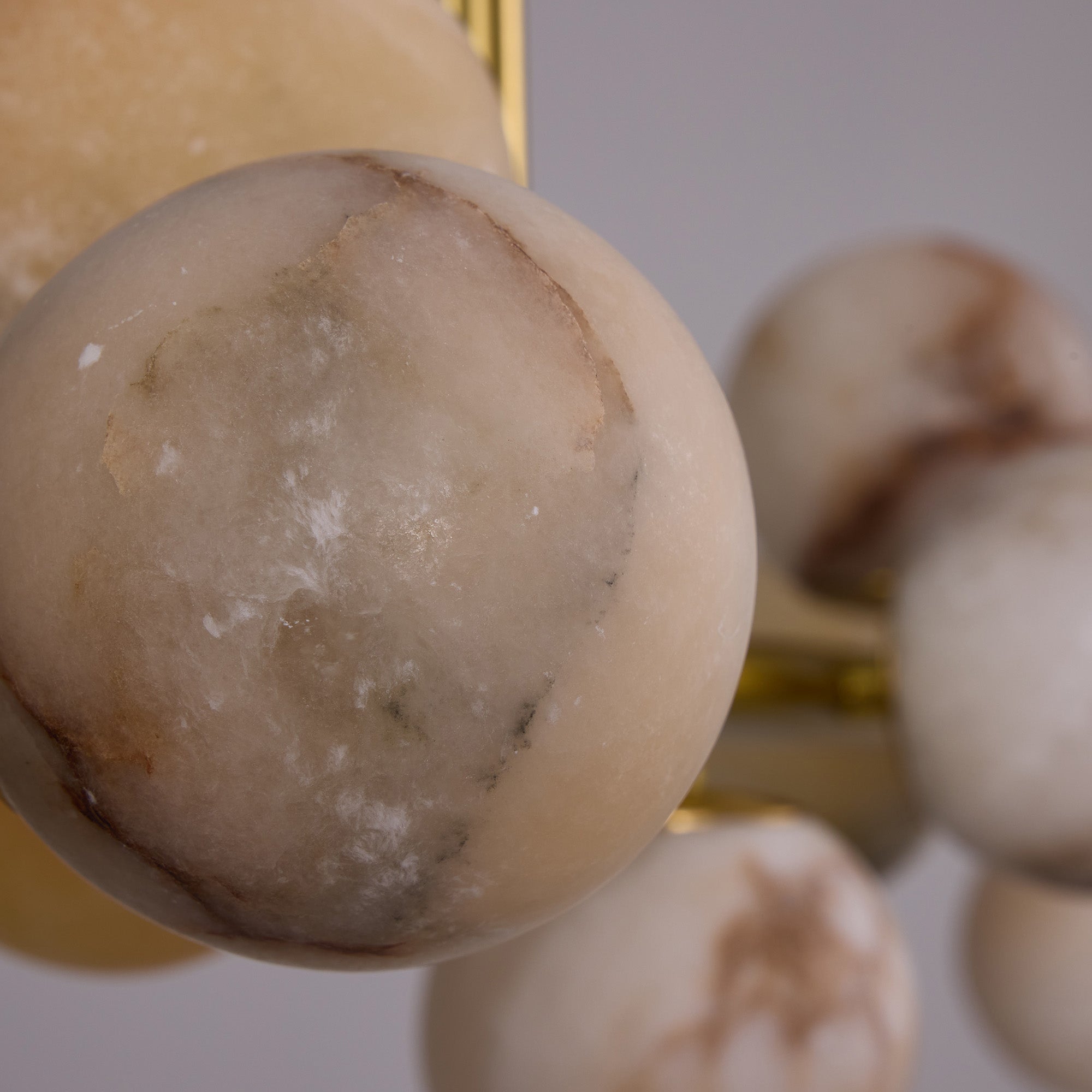 orbelia modern luxury gold alabaster globe linear chandelier natural alabaster veining detail