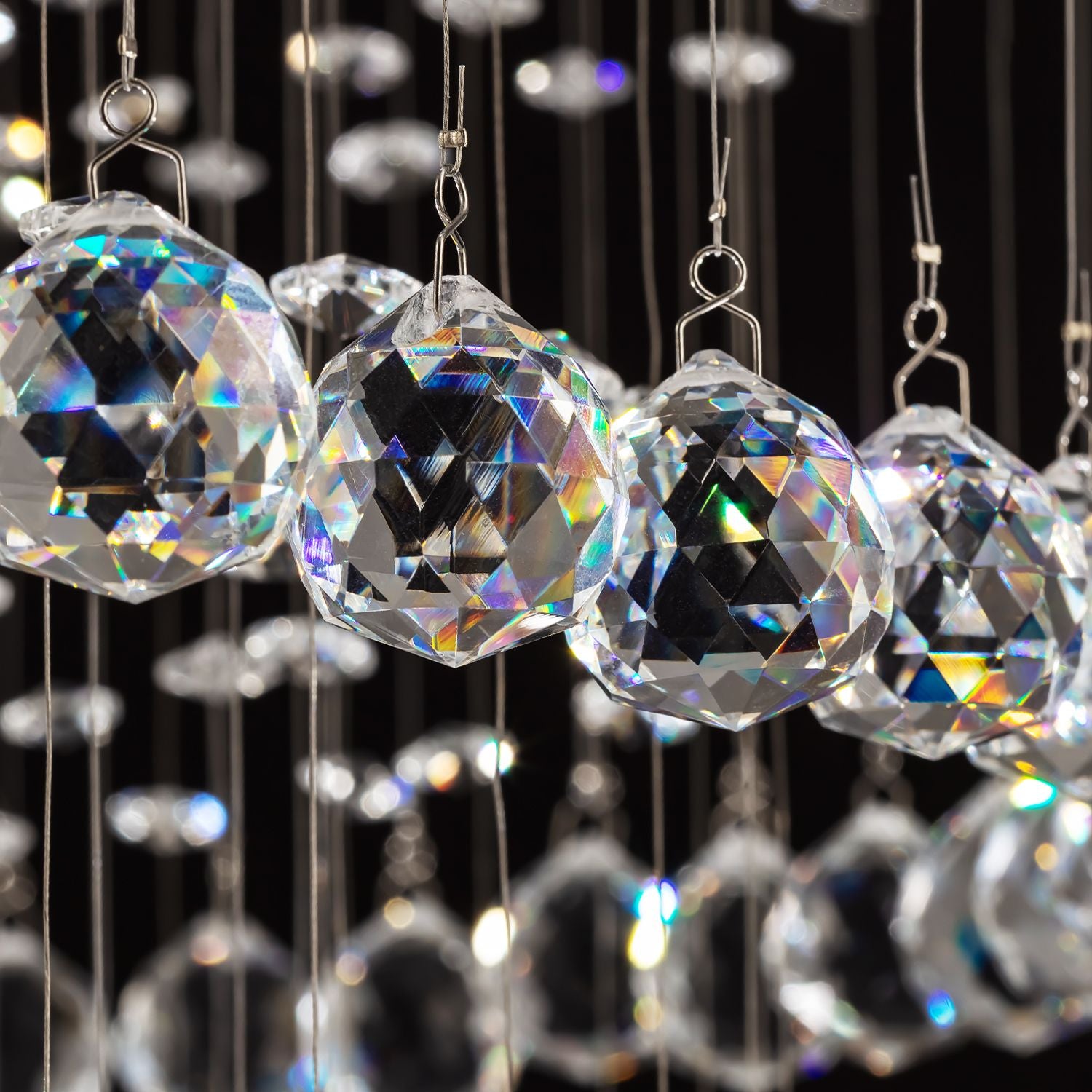 macro detail of premium cut crystal balls reflecting light in luxury modern chandelier | Sofary Lighting