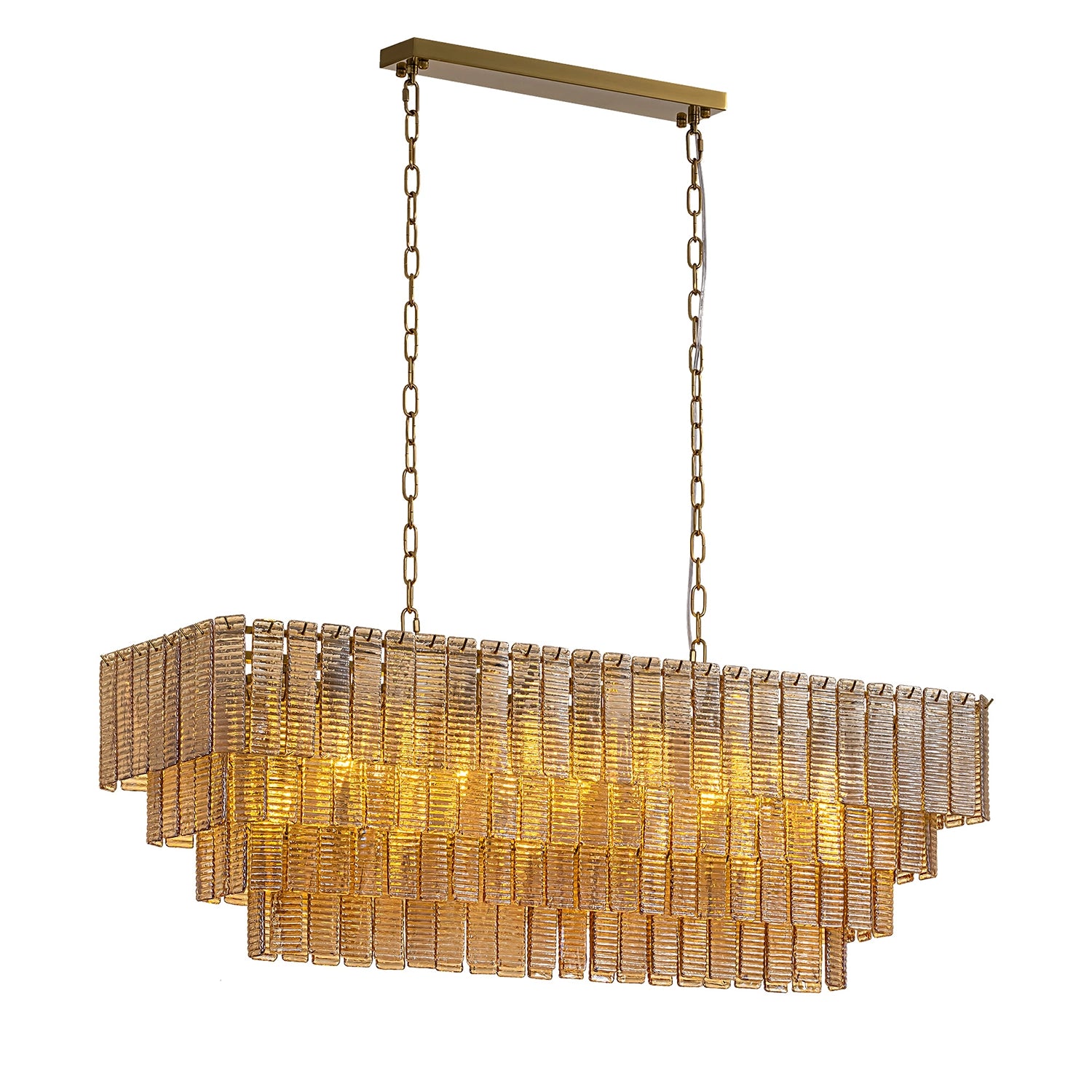 Rectangular tiered amber glass chandelier with a warm golden glow and brass hanging chains against a white background.