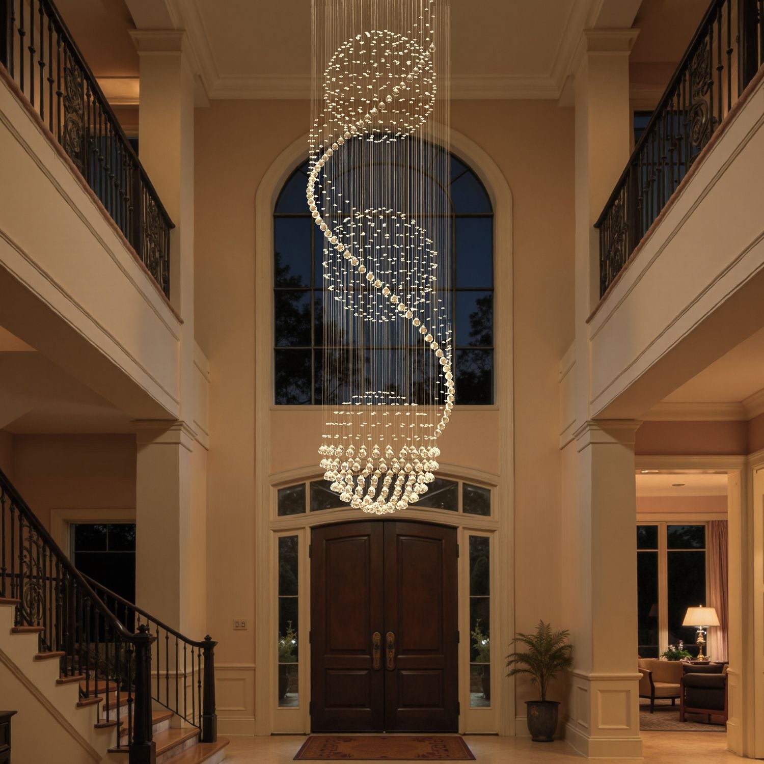 Spiral crystal chandelier featuring three sphere raindrop design in a grand entryway | Sofary