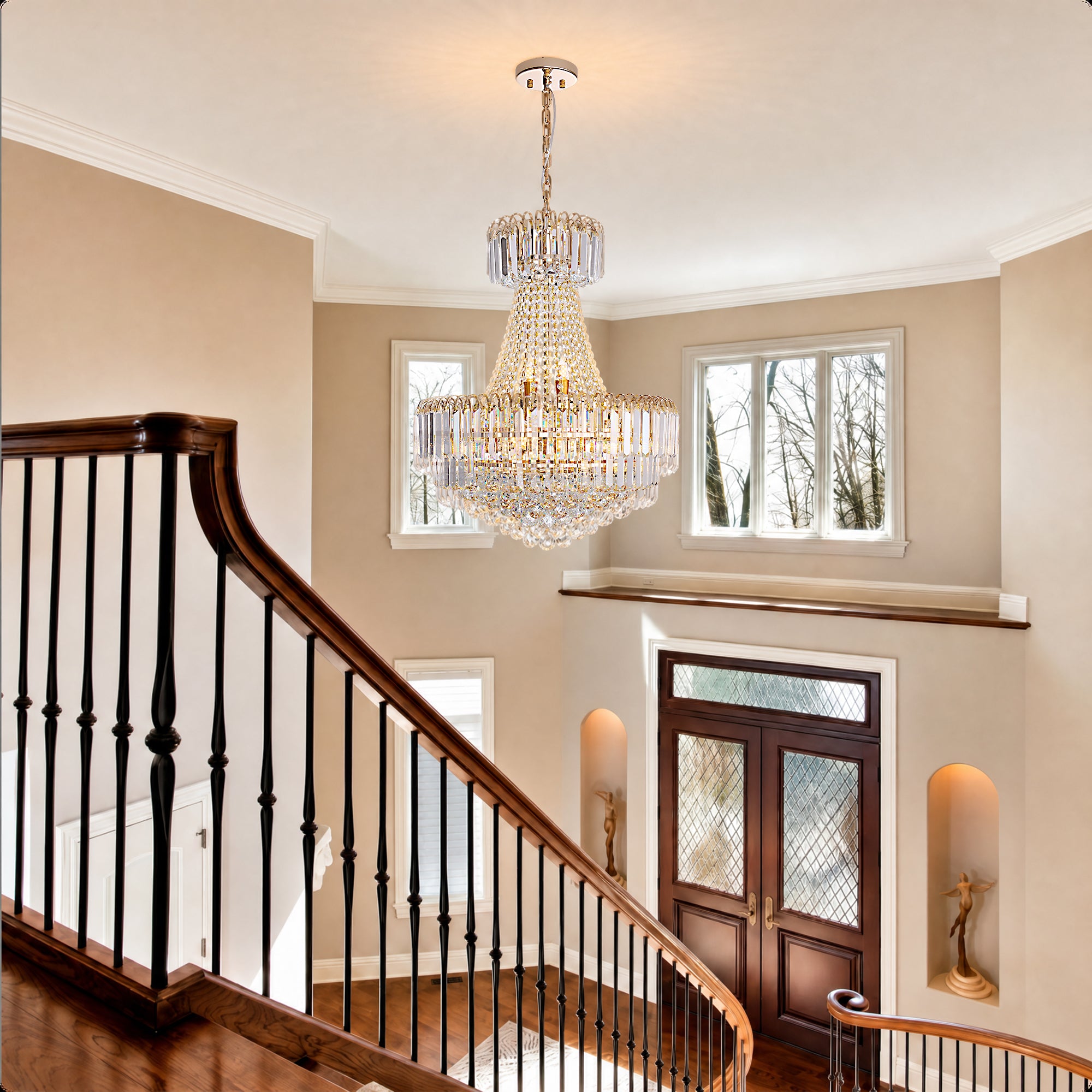 Valerisse gold crystal tiered empire chandelier above a staircase entryway