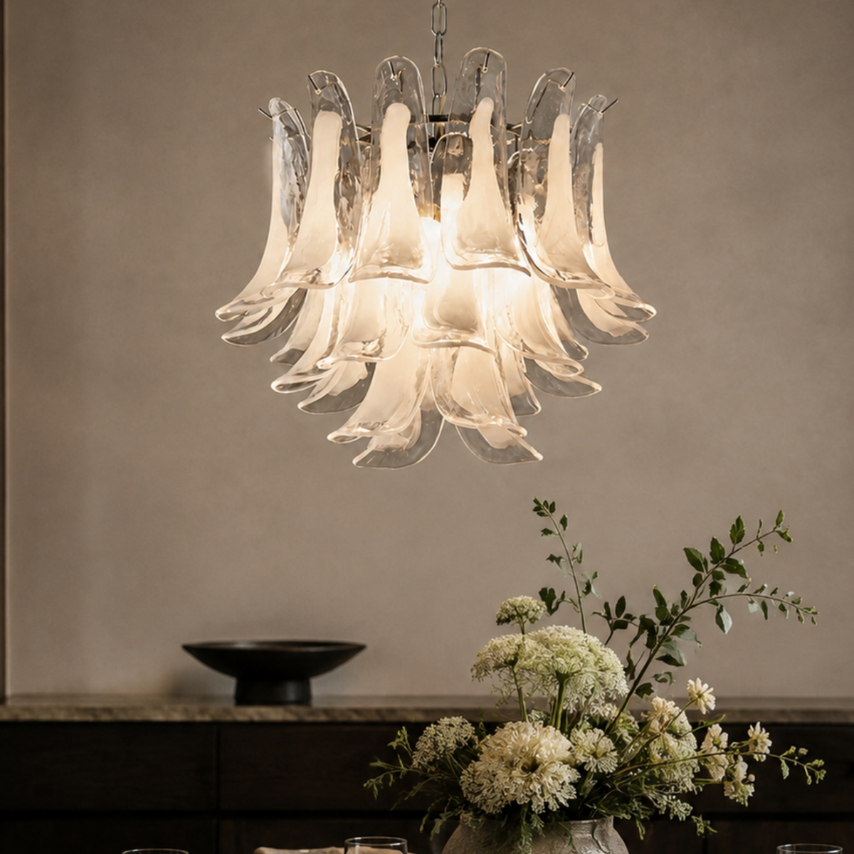 Veloria silver hand-formed glass petal chandelier in a dining room close-up