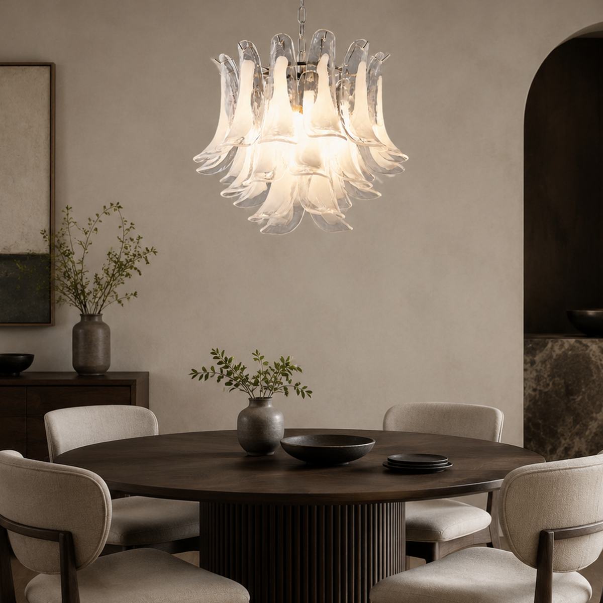 Veloria round glass petal chandelier above a dining table