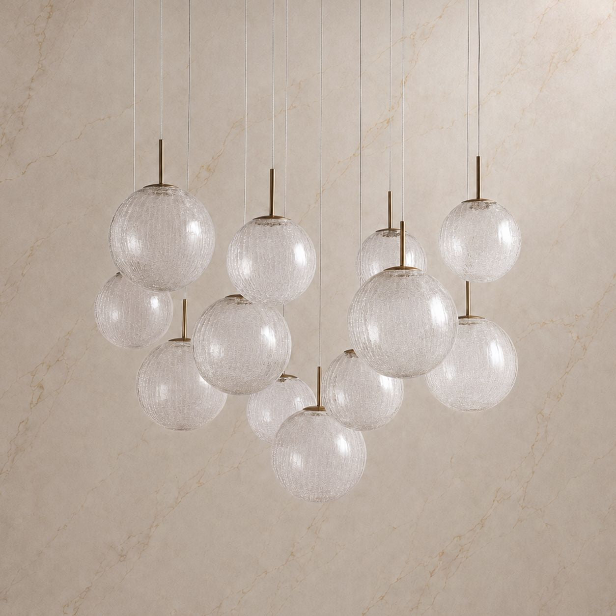 Veritas Sculptural Chandelier unlit — clear crackle-textured glass spheres, minimalist brass hardware, elegant form | Sofary Lighting