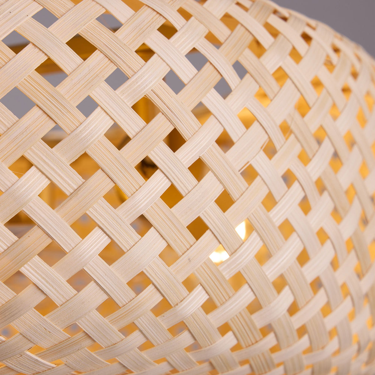 Woven rattan cage shade detail — natural bamboo weave, lattice pattern, warm light diffusion, rustic handcrafted texture | Sofary Lighting