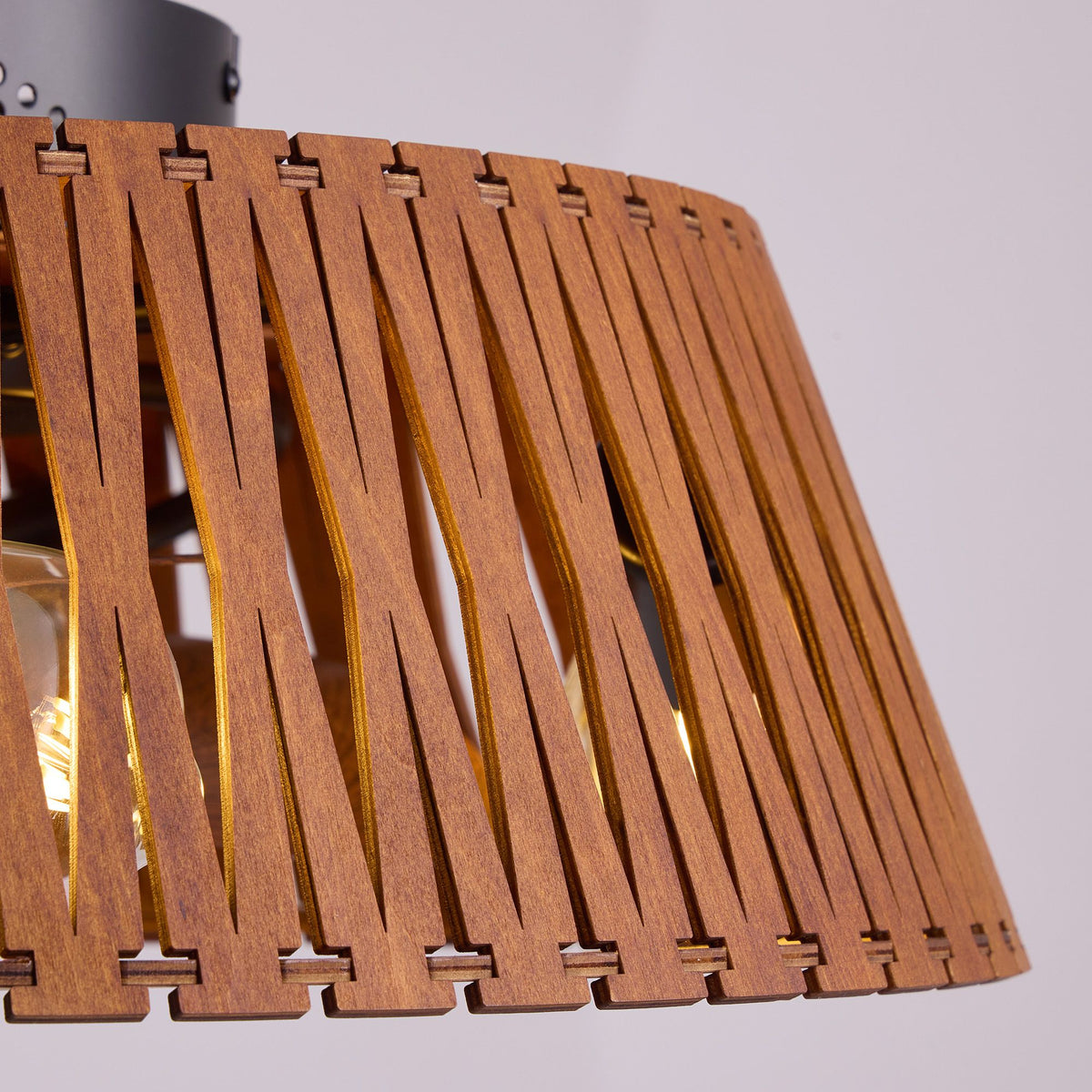 Close-up of brown caged ceiling fan base — black matte motor housing, ventilation holes, sturdy build, modern rustic craftsmanship | Sofary Lighting