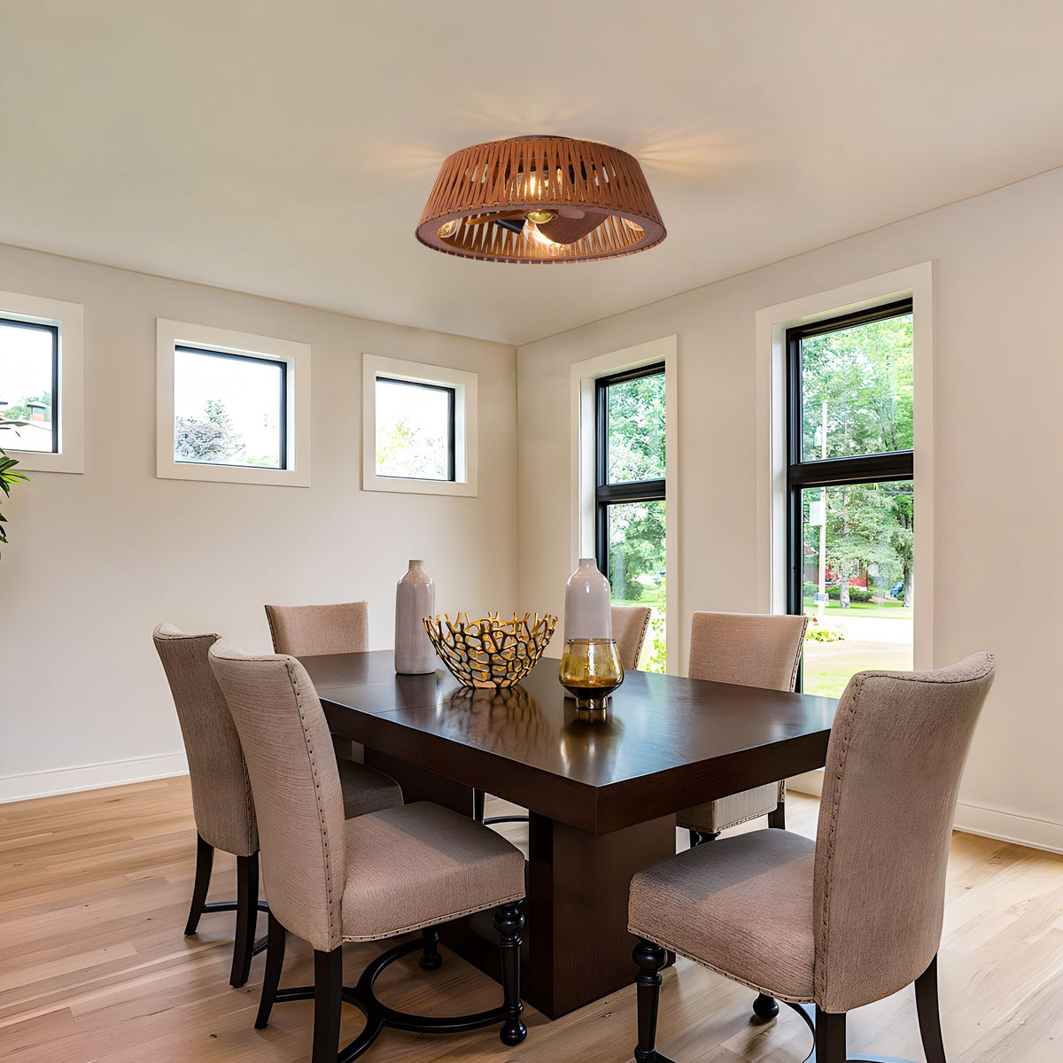 Modern brown caged fan in dining room — dark wood dining table, beige upholstered chairs, warm wooden slat shade, cozy home decor | Sofary Lighting