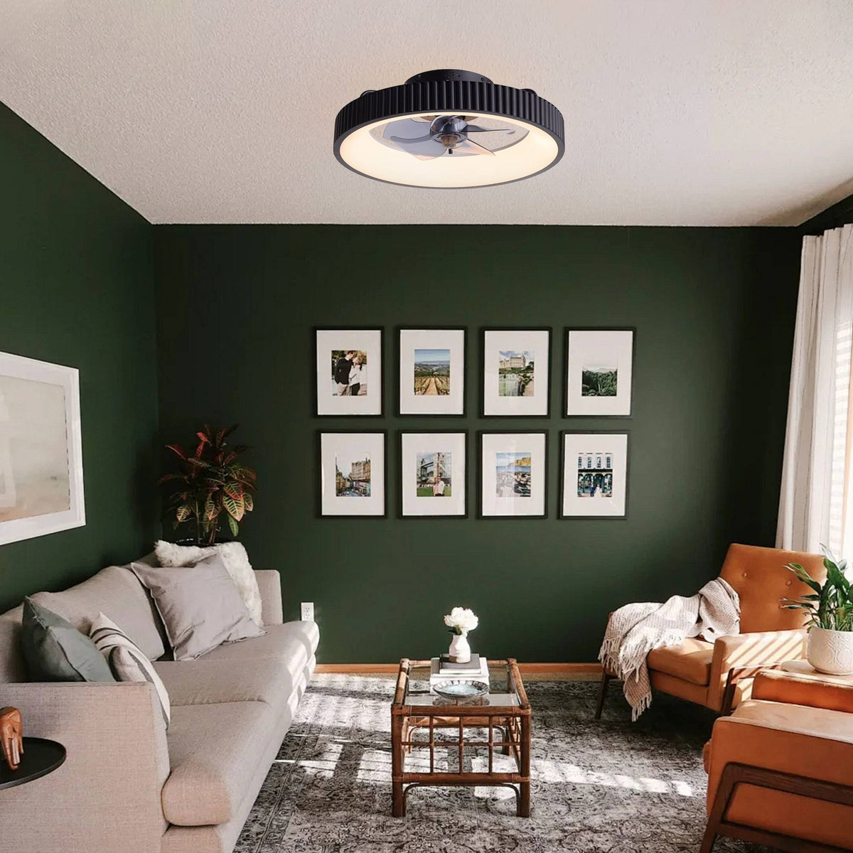 Smart ceiling fan in lounge/study — dark green wall, gallery frames, beige sofa, orange armchair, modern decor, quiet flush mount fan