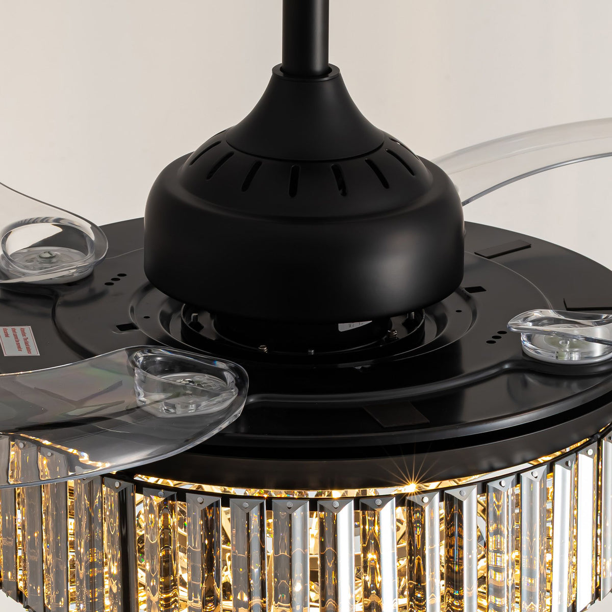 Close-up of black motor housing — 36" retractable ceiling fan, clear acrylic blades extended, crystal shade detail | Sofary Lighting