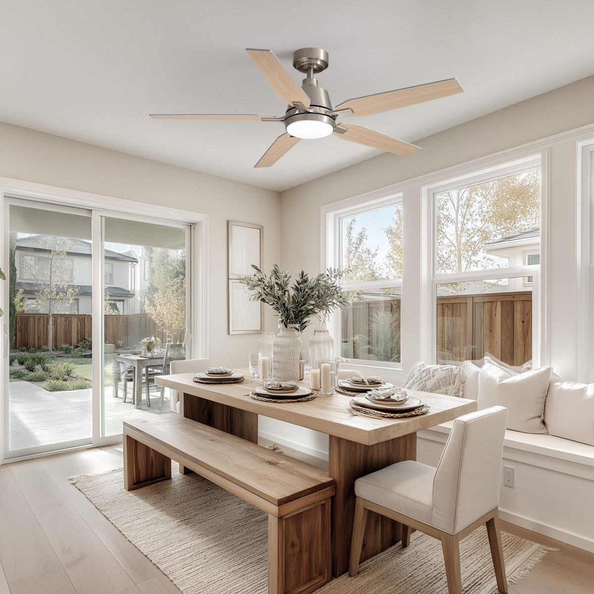Smart ceiling fan in bright dining room — solid wood table, bench seating, white chairs, sliding glass door to backyard, natural light, cozy farmhouse decor | Sofary Lighting