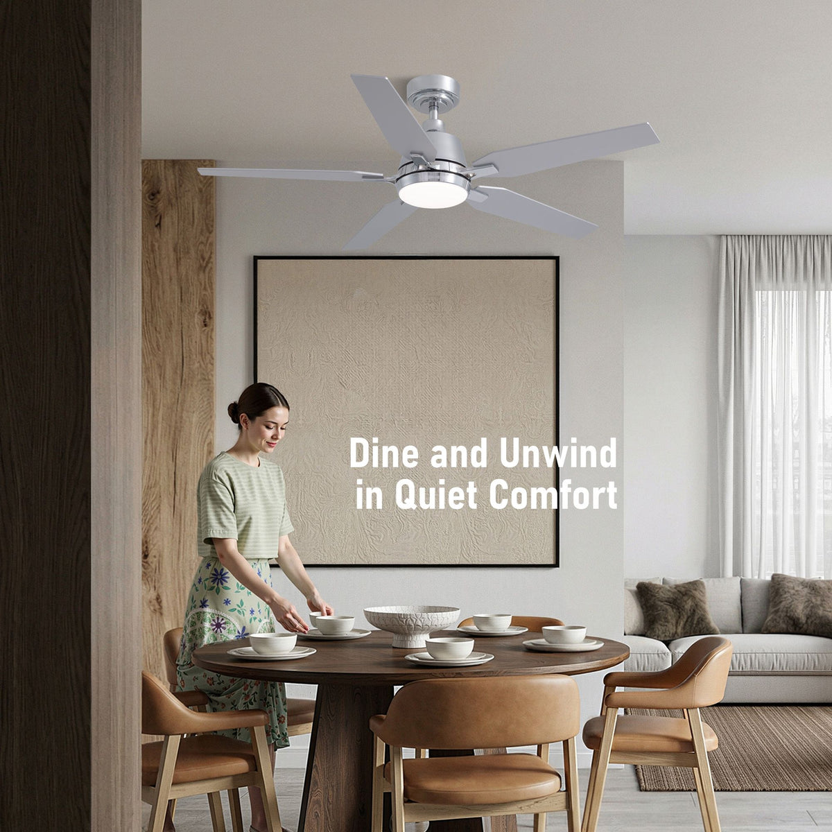 Dine and unwind in quiet comfort — chrome ceiling fan, round wood dining table, leather chairs, warm ambient lighting, peaceful home