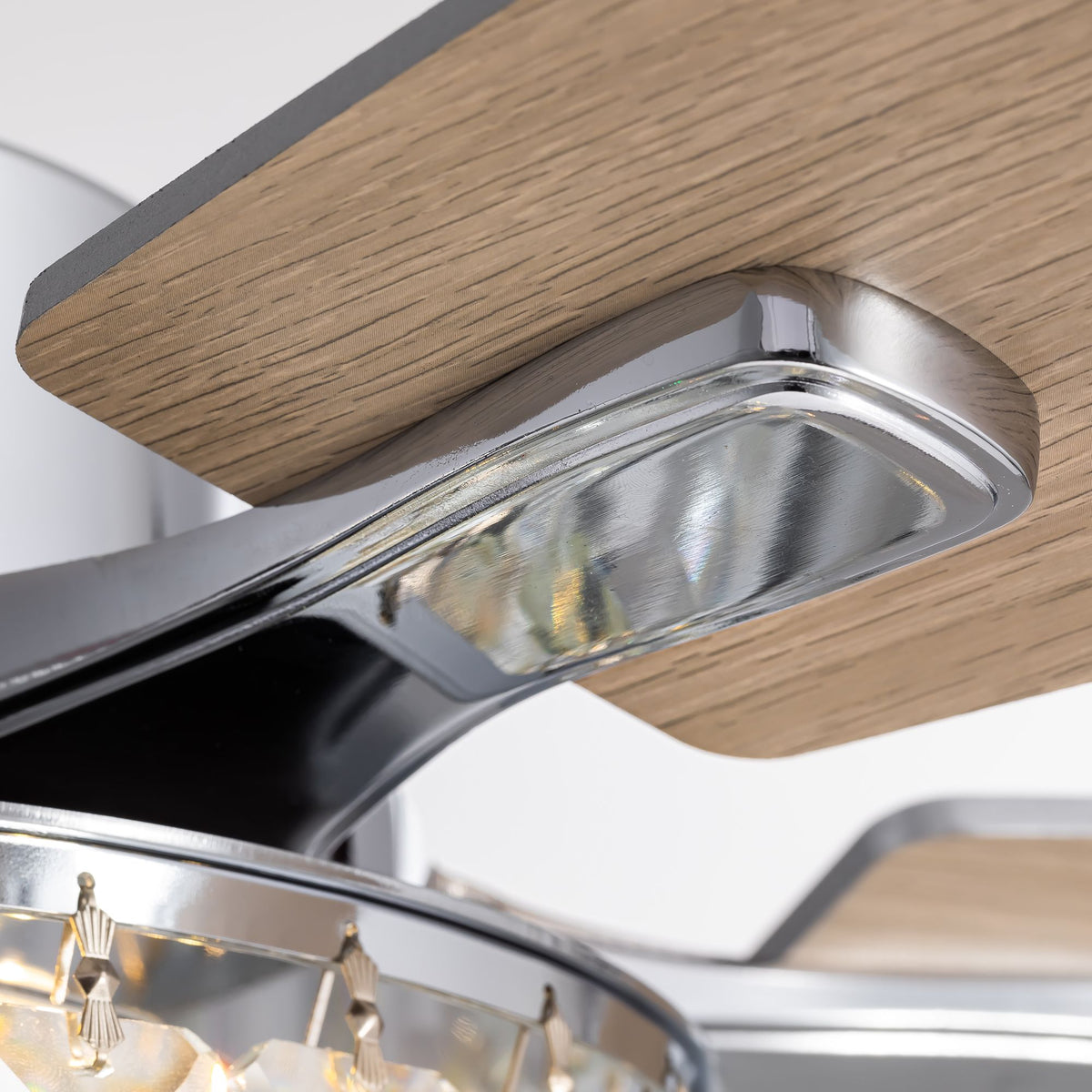 Close-up of wood grain fan blade and chrome metal bracket — solid wood texture, sleek connector, crystal light edge, premium craftsmanship | Sofary Lighting