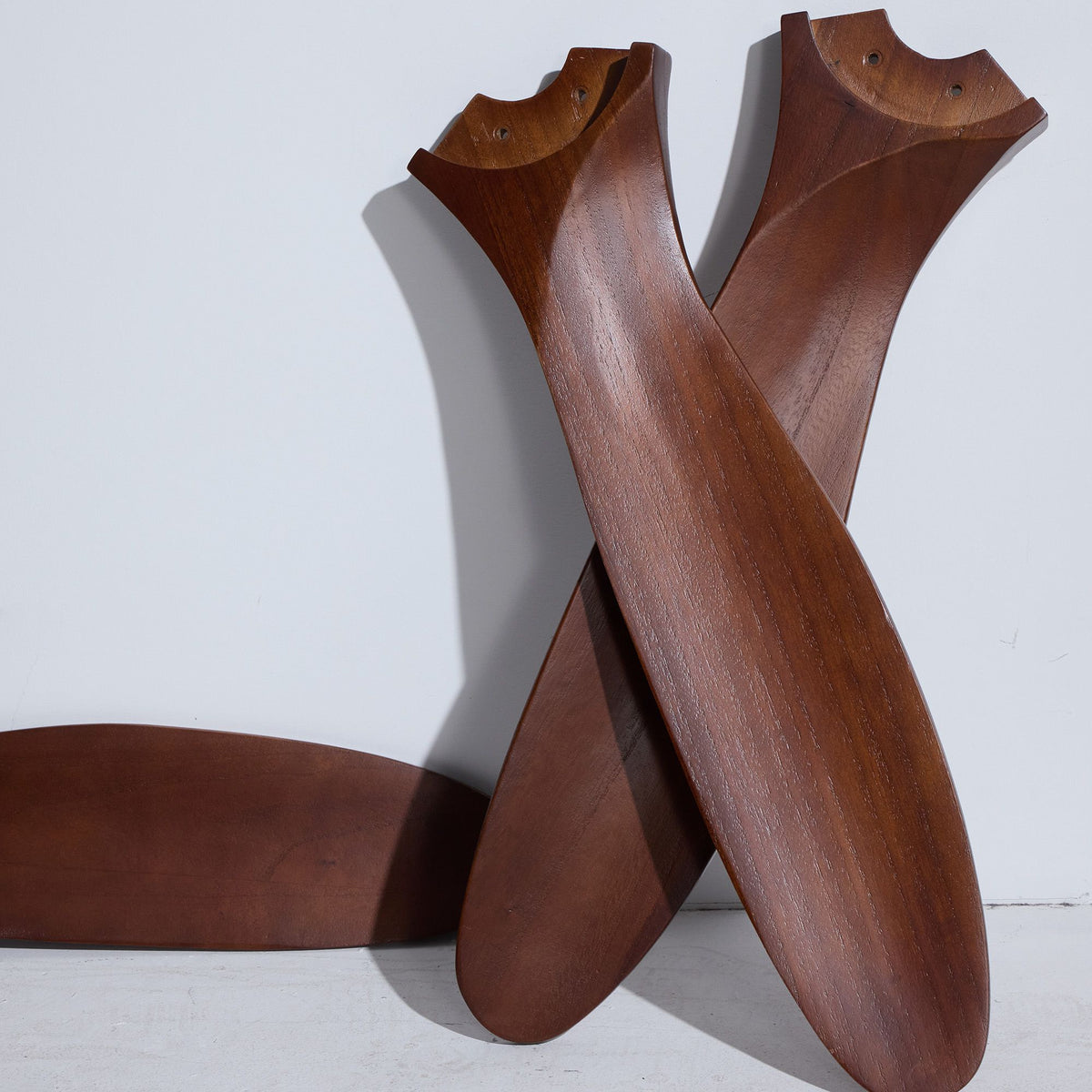 Solid wood fan blades detail — natural dark wood grain, curved aerodynamic shape, 3-blade design, premium solid wood craftsmanship | Sofary Lighting