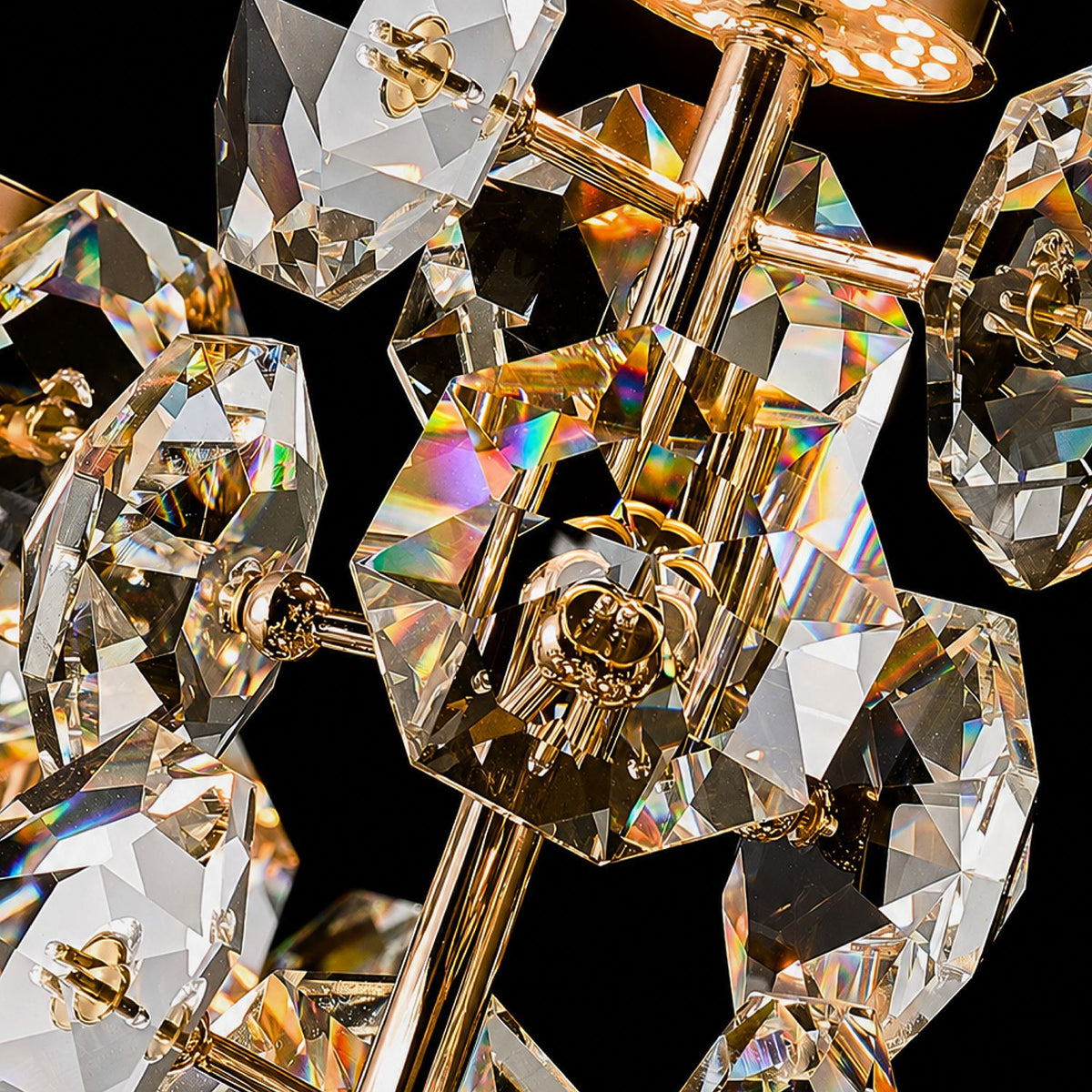 Aeriol grand staircase chandelier extreme close-up — faceted K9 crystal jewels, gold electroplated arms, ornate metal connectors, rainbow light refraction, hand-assembled luxury detailing against black background | Sofary Lighting