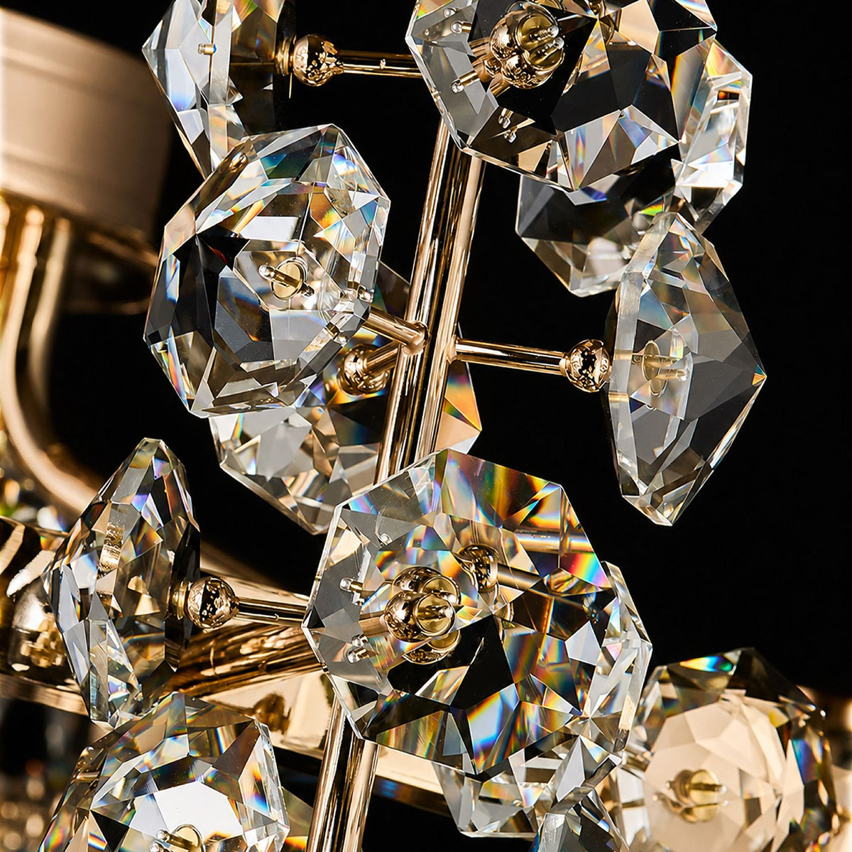 Aeriol close-up — precision-cut K9 crystal pendants on gold electroplated arms, faceted light refraction, rainbow prisms, hand-assembled crystal strands against dark background for maximum brilliance | Sofary Lighting