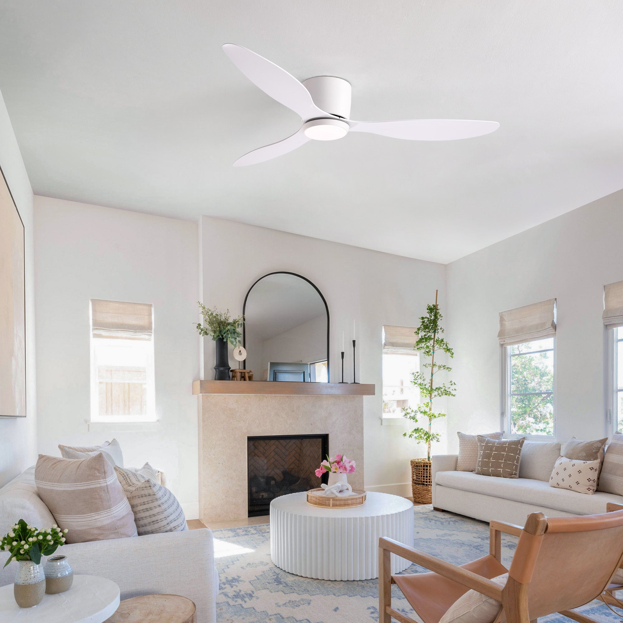 Aeroform White Ceiling Fan in bright modern living room — large windows, beige sofa, natural light, stylish air circulation without sacrificing aesthetics | Sofary Lighting