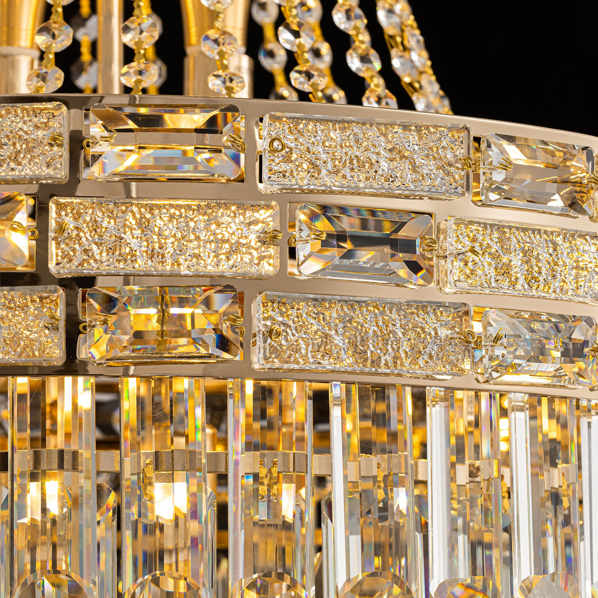 Close-up of Aeros Empire Chandelier frame — gold metal ring with rectangular crystal blocks, glittering crushed crystal accents, faceted K9 prisms, premium craftsmanship | Sofary Lighting