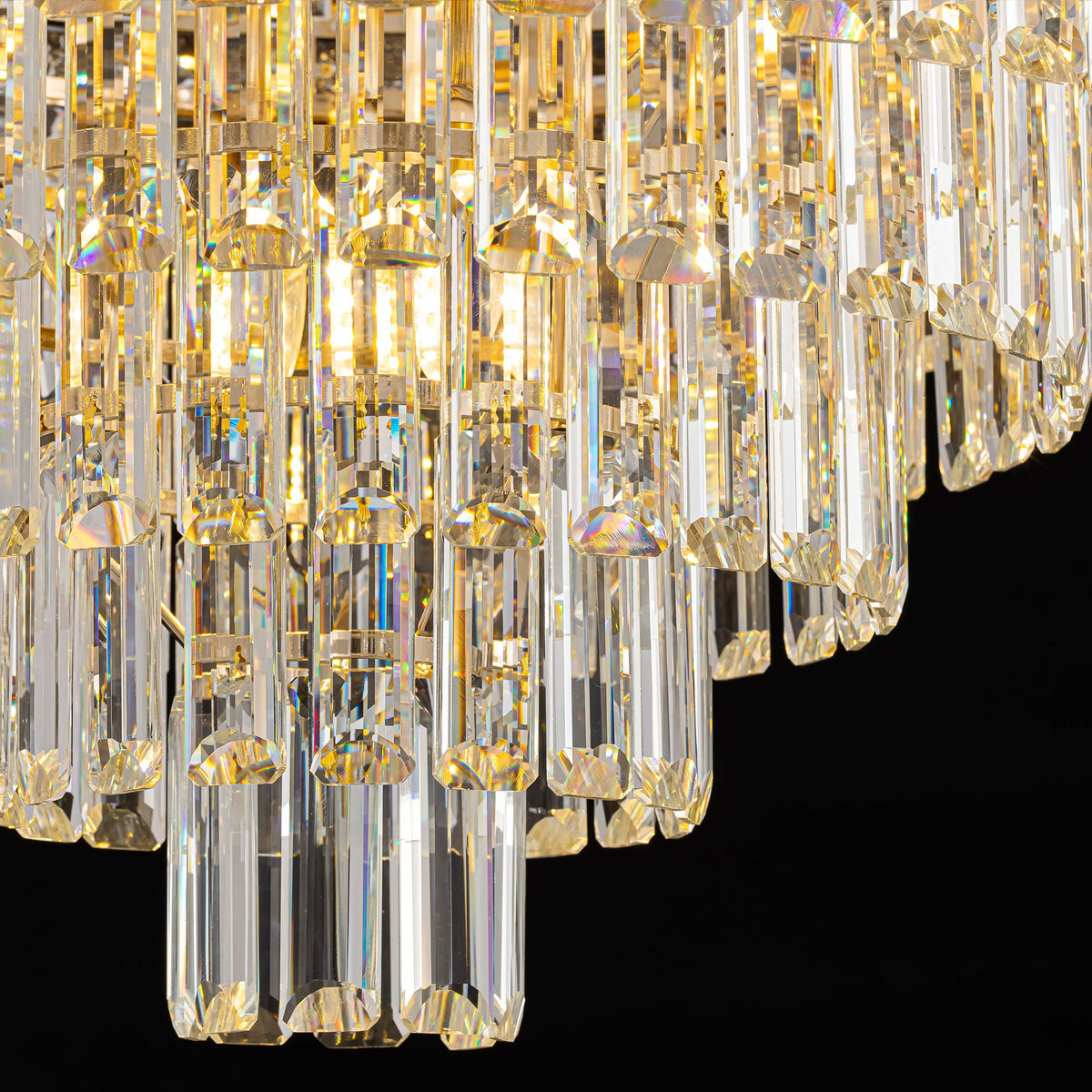 Close-up of Aeros Empire Crystal Chandelier crystals — cascading clear rectangular K9 crystal drops, light refraction and iridescent sparkle, black background | Sofary Lighting