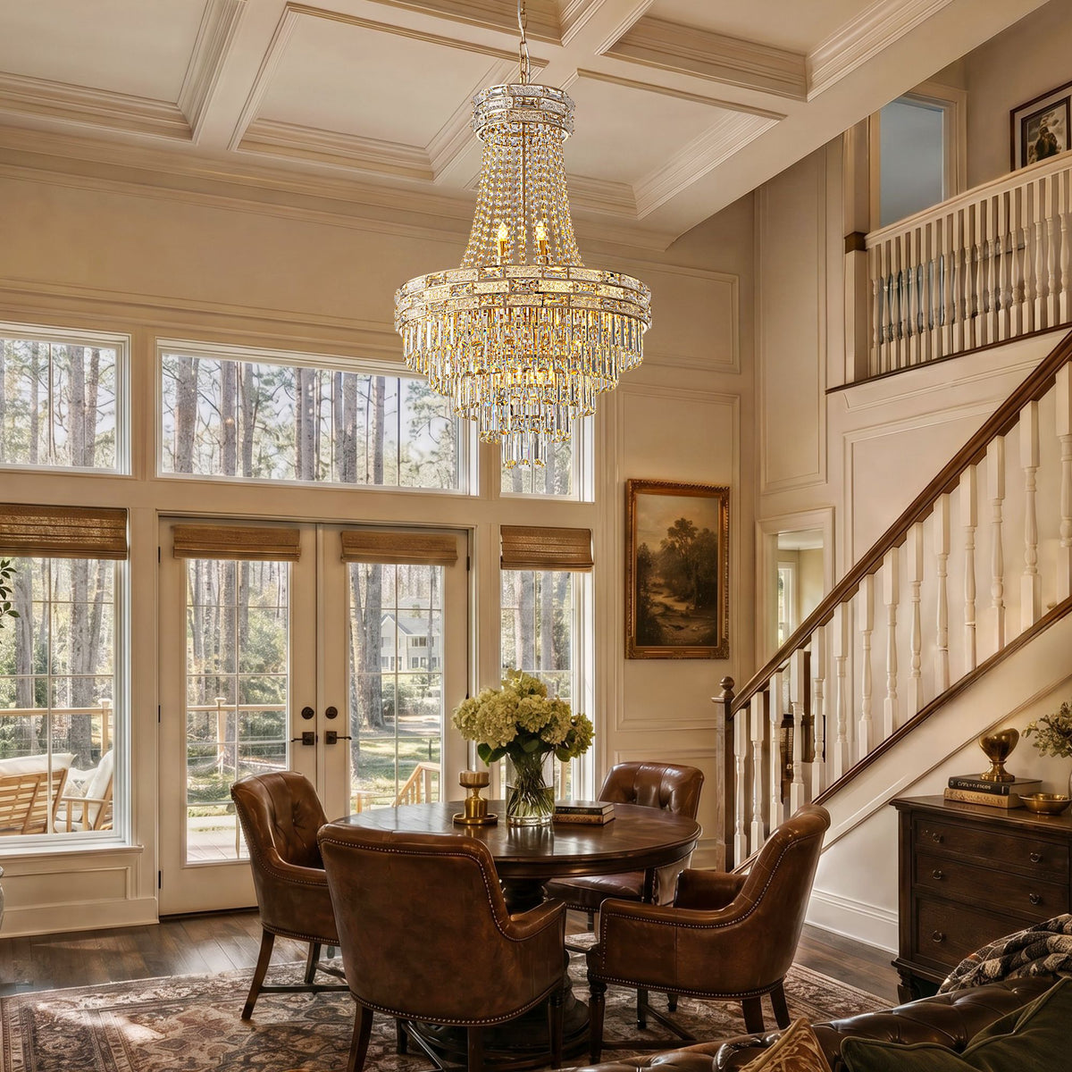 Aeros Empire Crystal Chandelier above formal dining table — wooden table, leather chairs, floral centerpiece, double-height windows, staircase balcony, warm ambient glow | Sofary Lighting