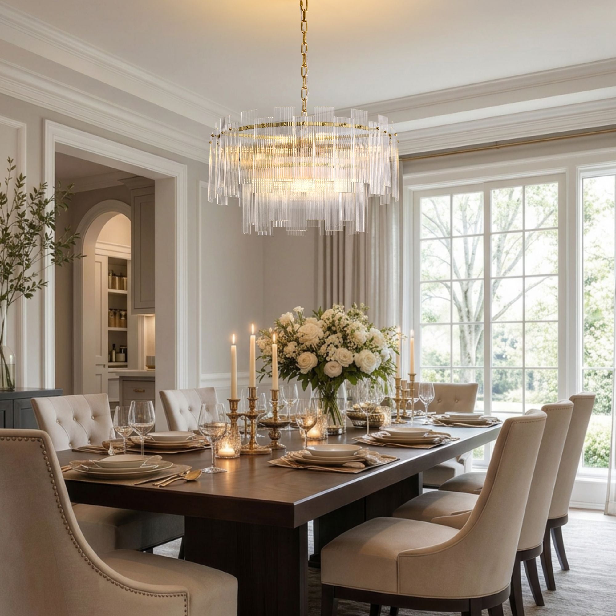 Aerosel Brass Glass Chandelier in bright dining room — white walls, large windows, dark wood table, beige chairs, floral centerpiece | Sofary Lighting
