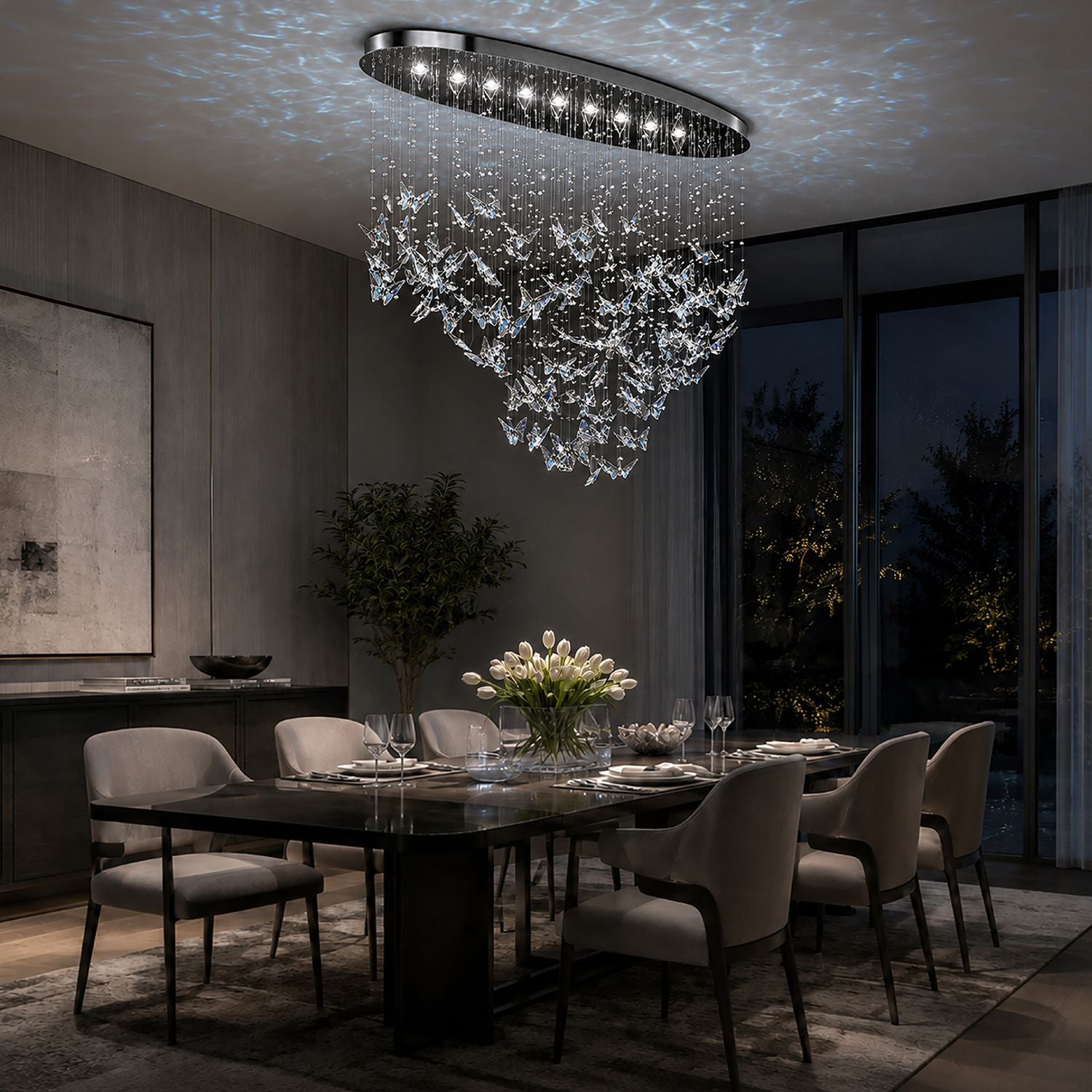 Aerosi Linear Crystal Chandelier in elegant dining room — white hydrangeas, marble table, dark walls, blue butterfly ceiling projection, sophisticated ambiance | Sofary Lighting