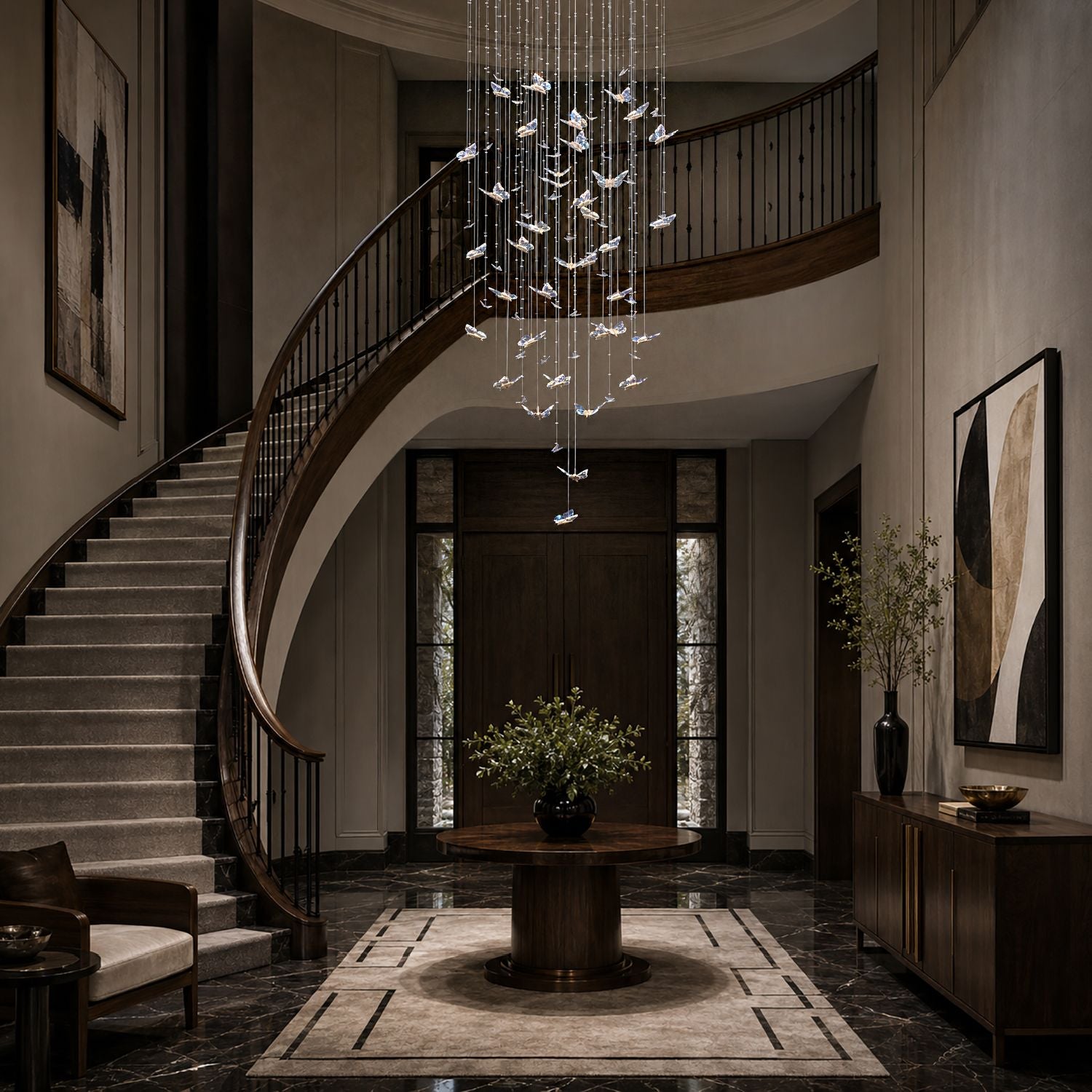 Aerosus K9 Crystal Waterfall Chandelier illuminating a grand foyer with dark wood, marble flooring, and sculptural art — creating a dramatic first impression | Sofary Lighting