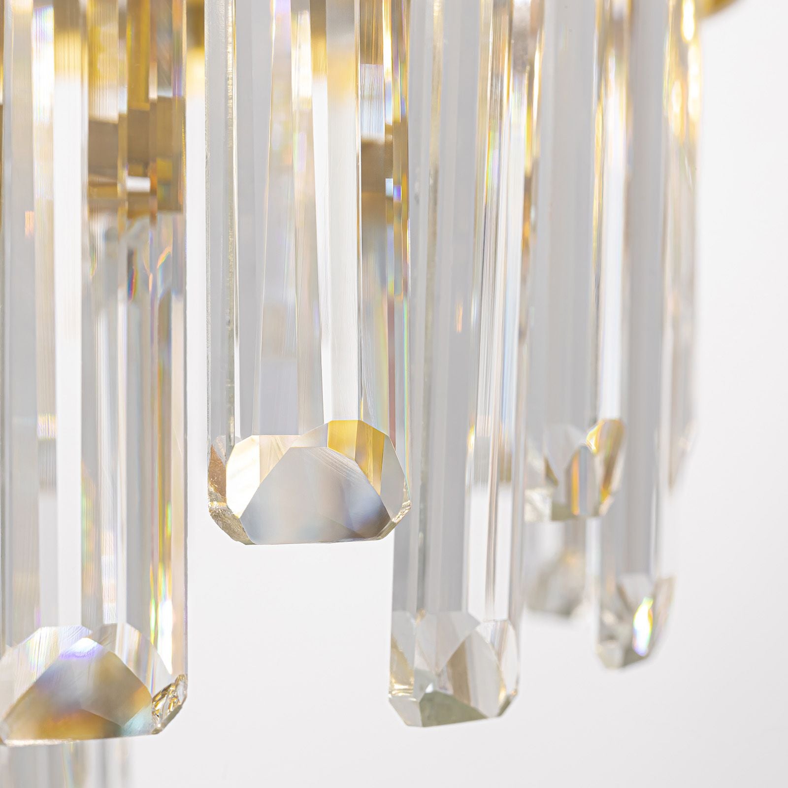 Close-up of Aeroz Chandelier — faceted K9 crystal rods, light refraction and sparkle, precision-cut ends, premium craftsmanship against soft background | Sofary Lighting