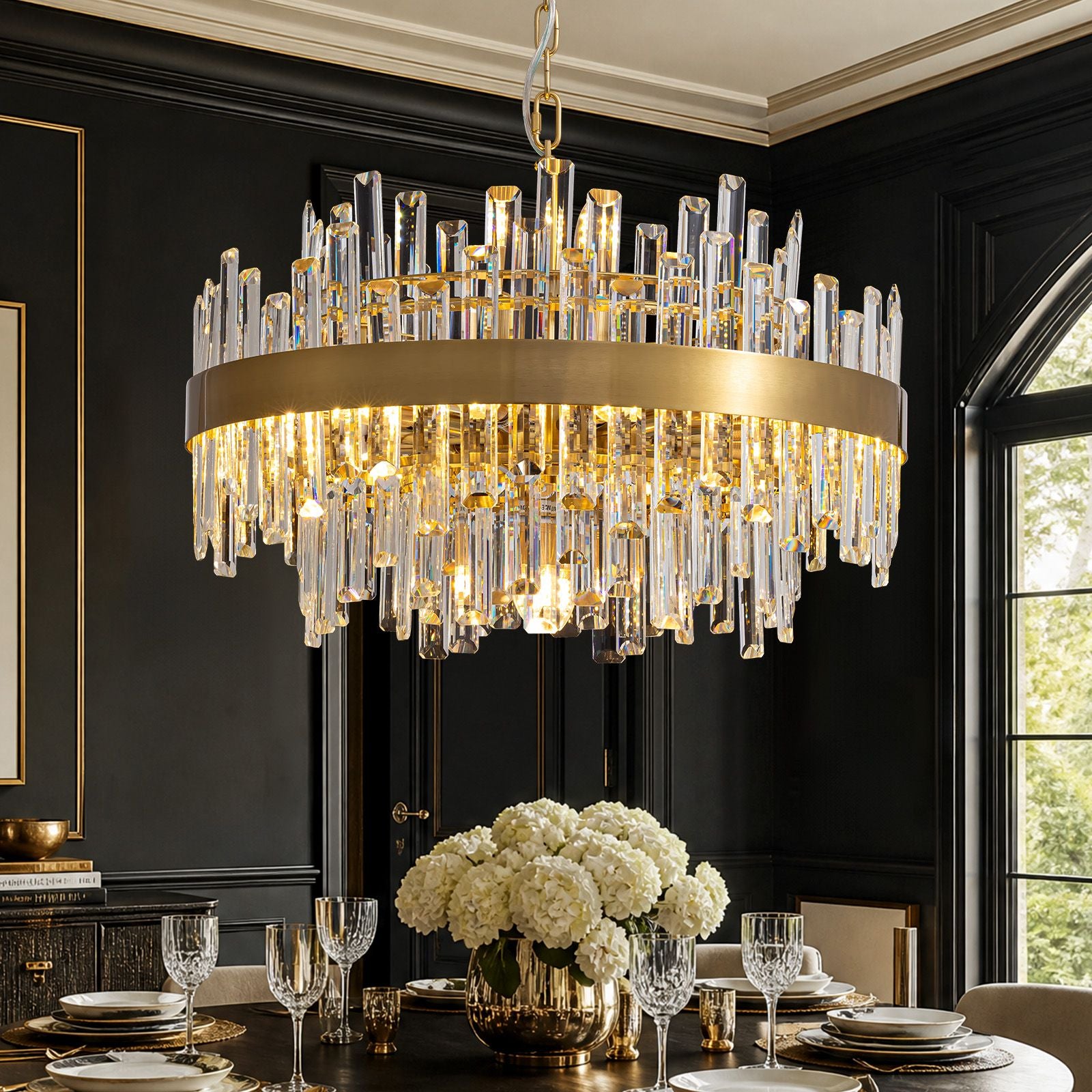 Aeroz Modern Gold Crystal Chandelier — round gold frame, cascading K9 crystals, warm glow, luxury black dining room with white flowers and table setting | Sofary Lighting