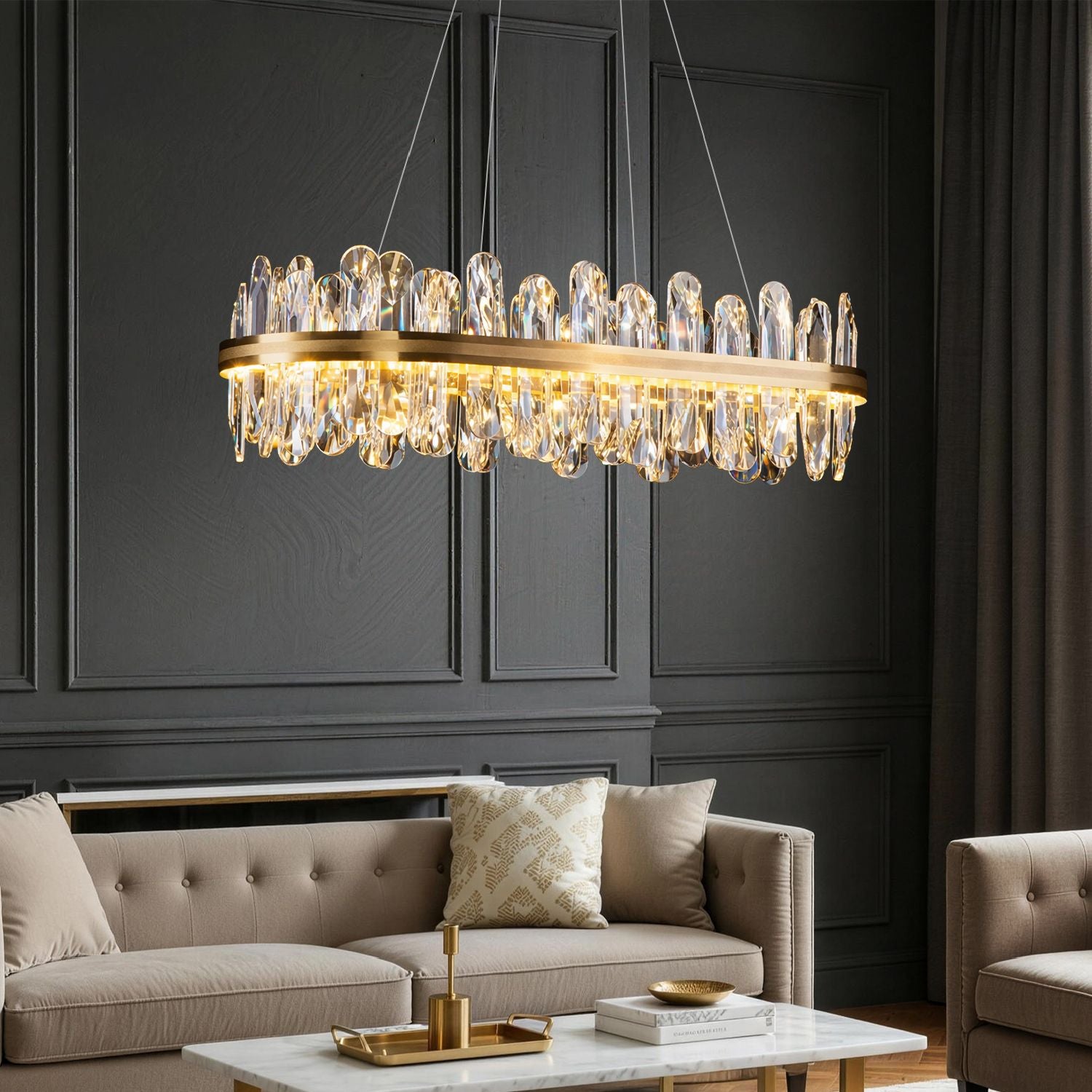 Aurelia Modern Luxury Champagne Gold Linear K9 Crystal LED Chandelier in a living room — hanging above a beige sofa with decorative pillows and a white coffee table | Sofary Lighting