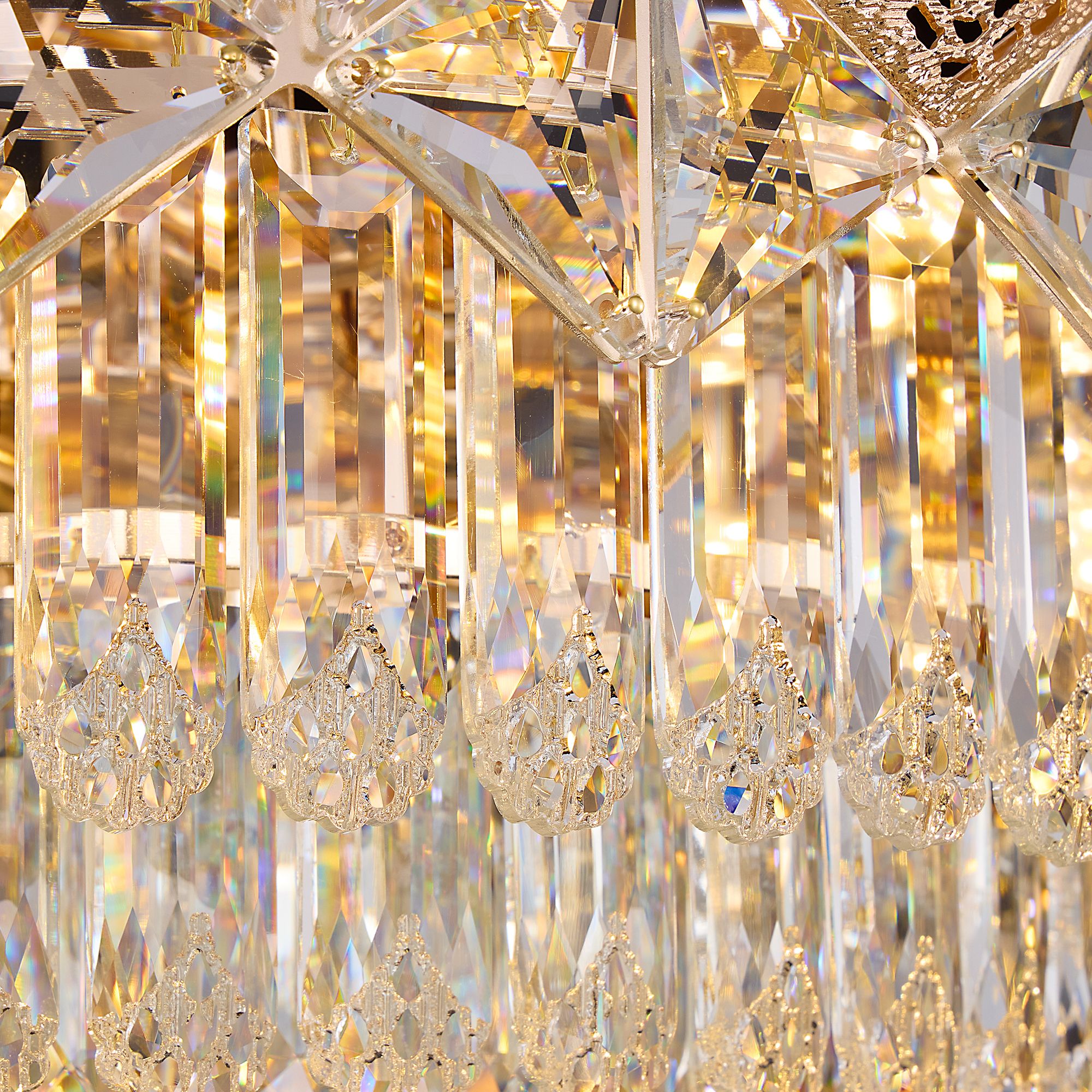 Close-up of Aureme Chandelier’s gold-tone metal base — textured grip band, polished finish, and secure chain attachment point | Sofary Lighting